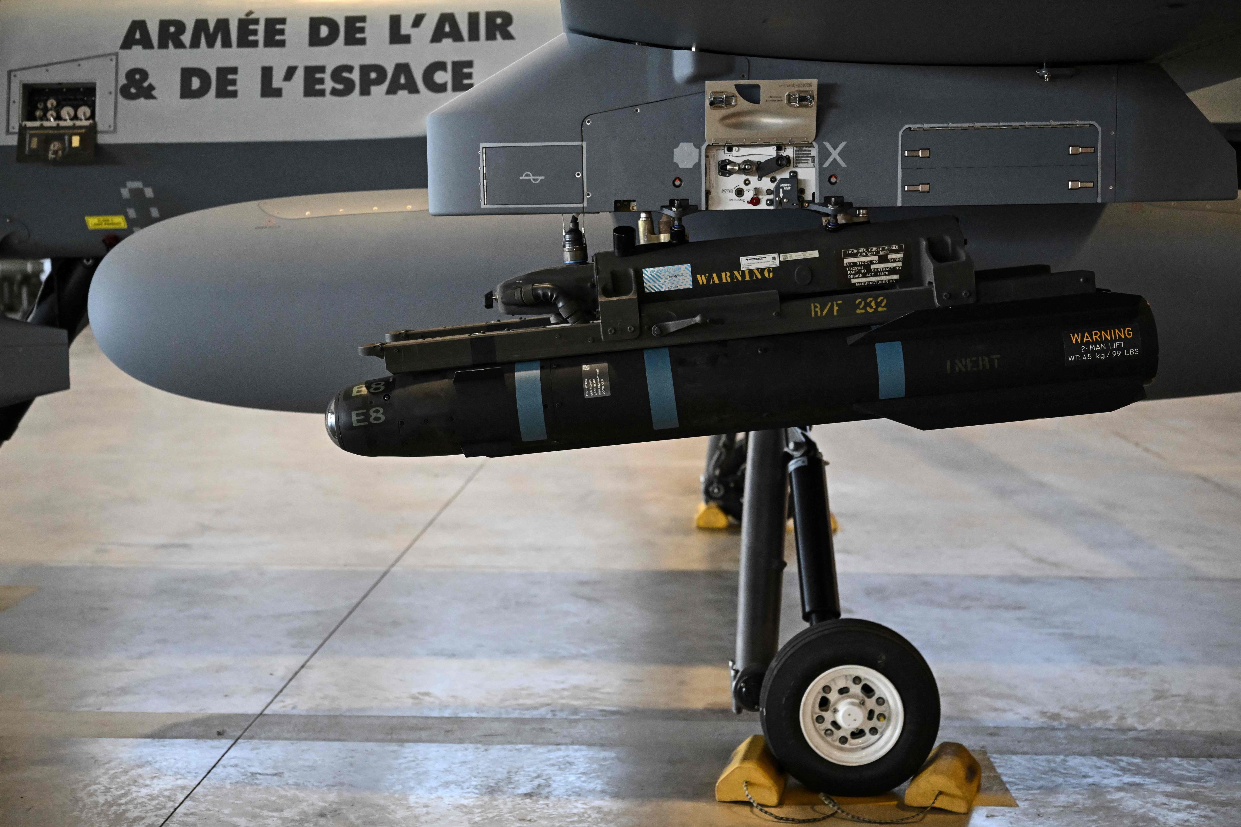 A model of a Hellfire missile attached under the wing of an MQ-9 Reaper military drone during a demonstration in Chateaubernard, France. Photo: AFP