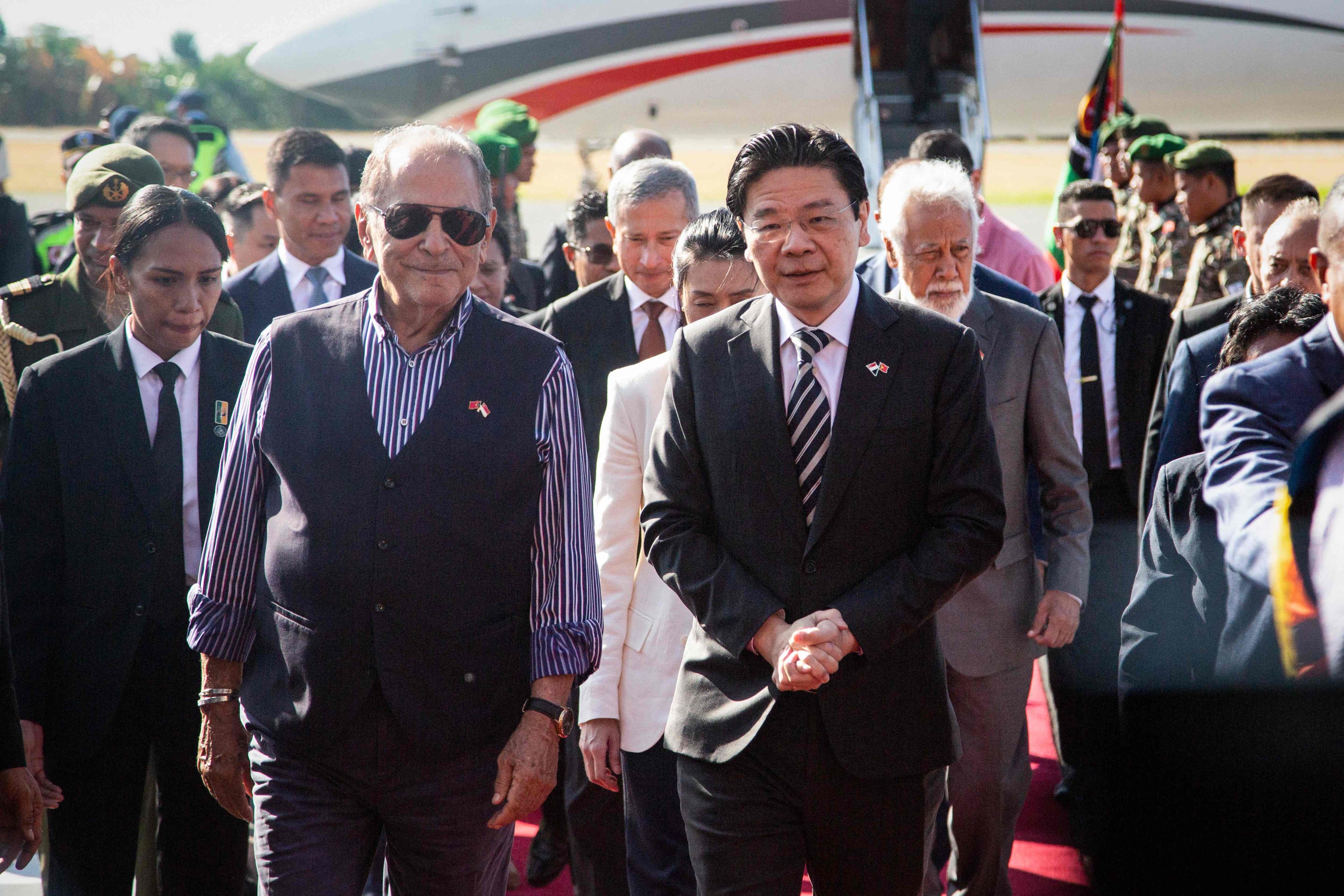 Singapore’s Prime Minister Laurence Wong (front right) is accompanied by East Timor President Jose Ramos-Horta upon his arrival in Dlili on Thursday. Photo: AFP