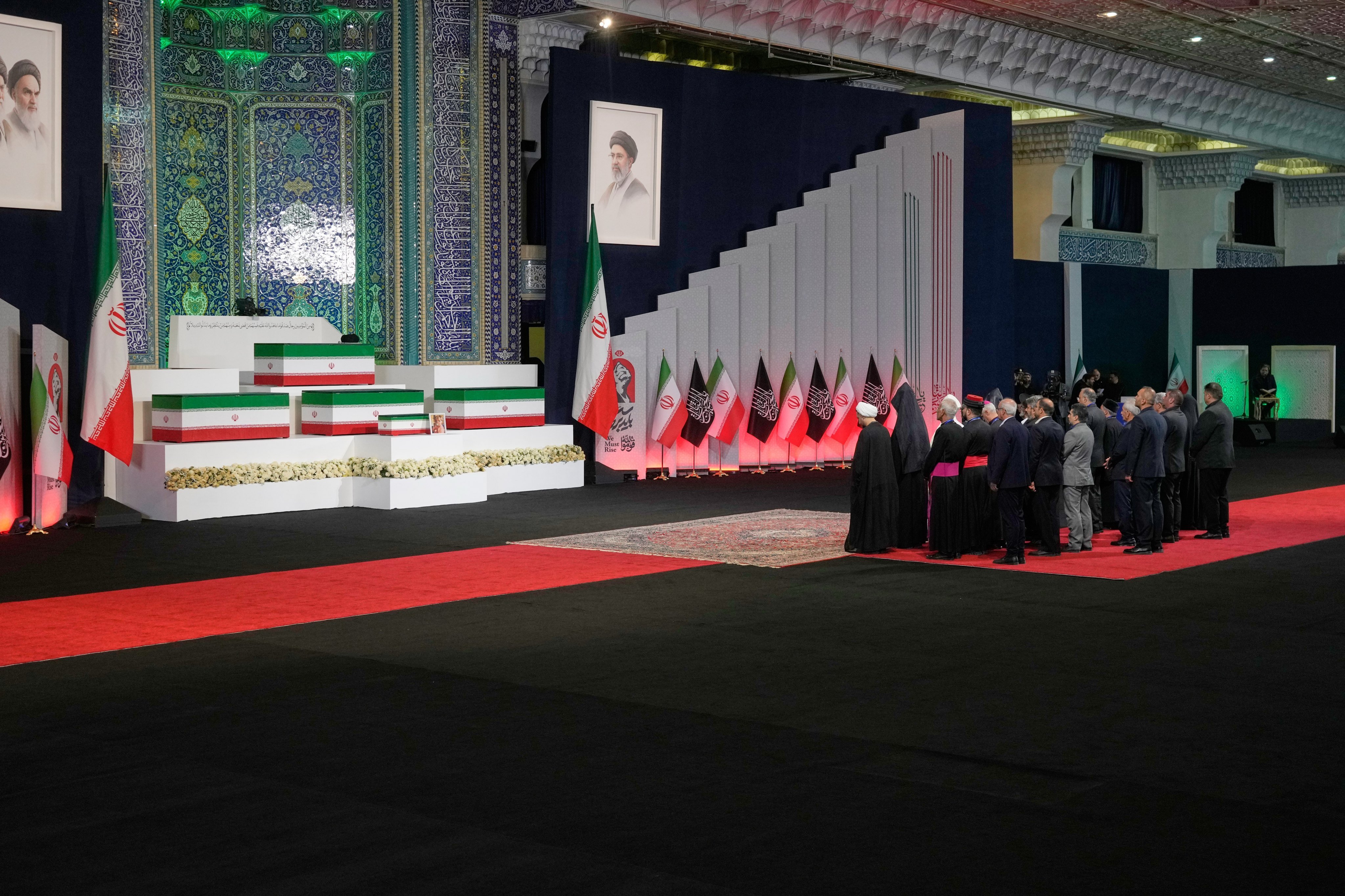 Iranian religious leaders and other mourners pay their respects. Photo: AP