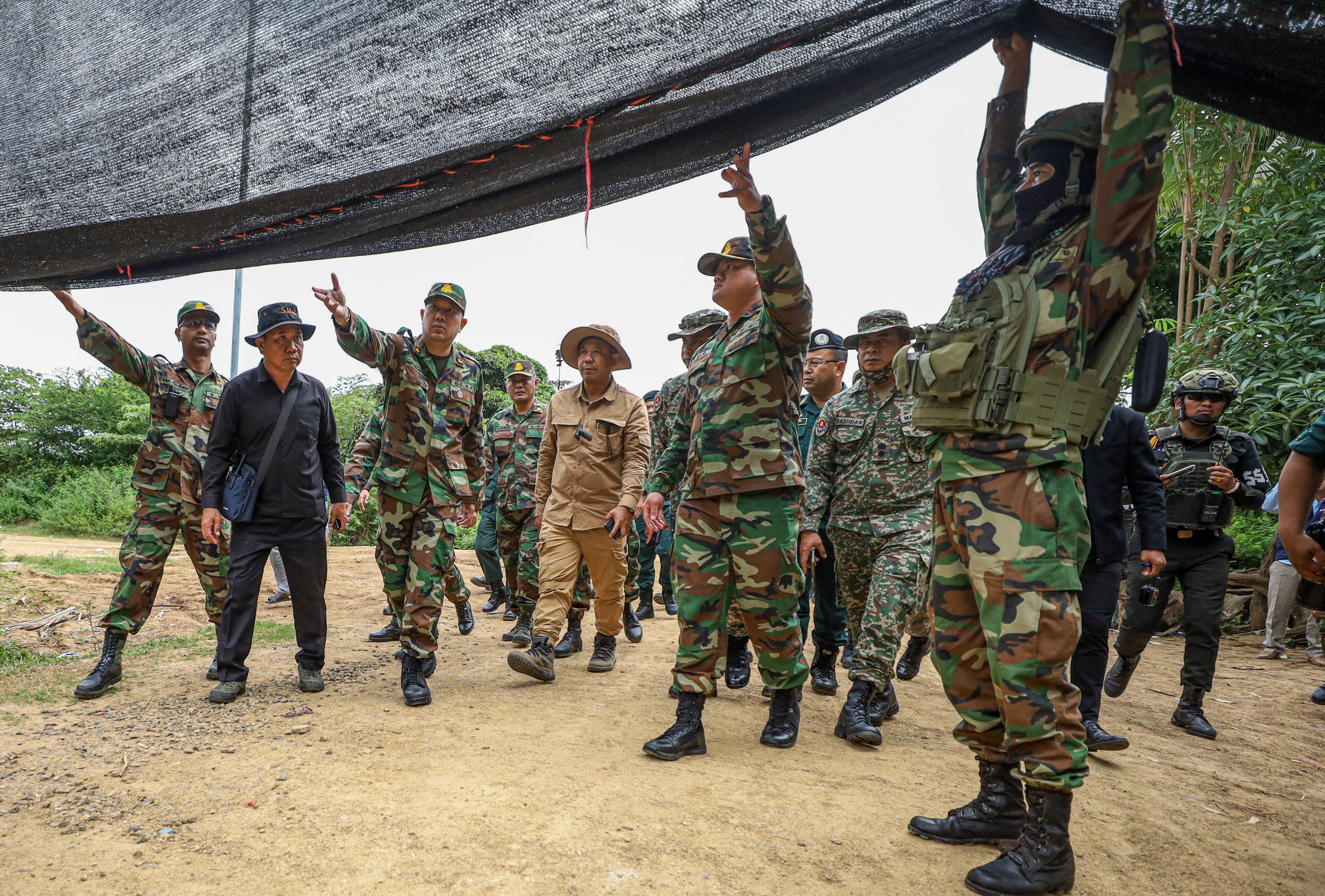 The Asean Observer Team visits an area of Cambodia’s Banteay Meanchey province where a civilian was killed. Photo: AKP/AFP