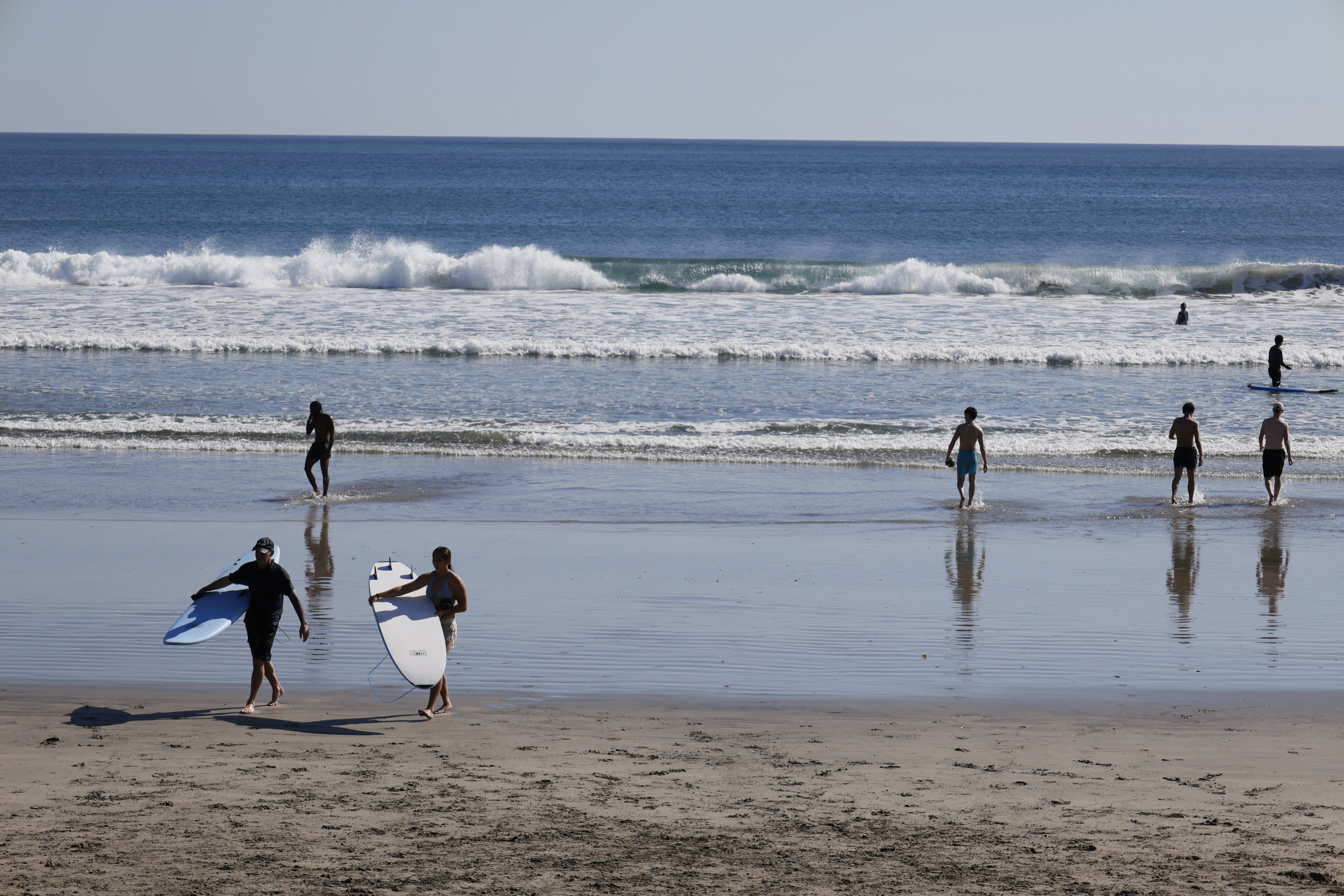 Tourists spend time at a beach in Kuta, Bali, Indonesia, on Wednesday. Photo: EPA
