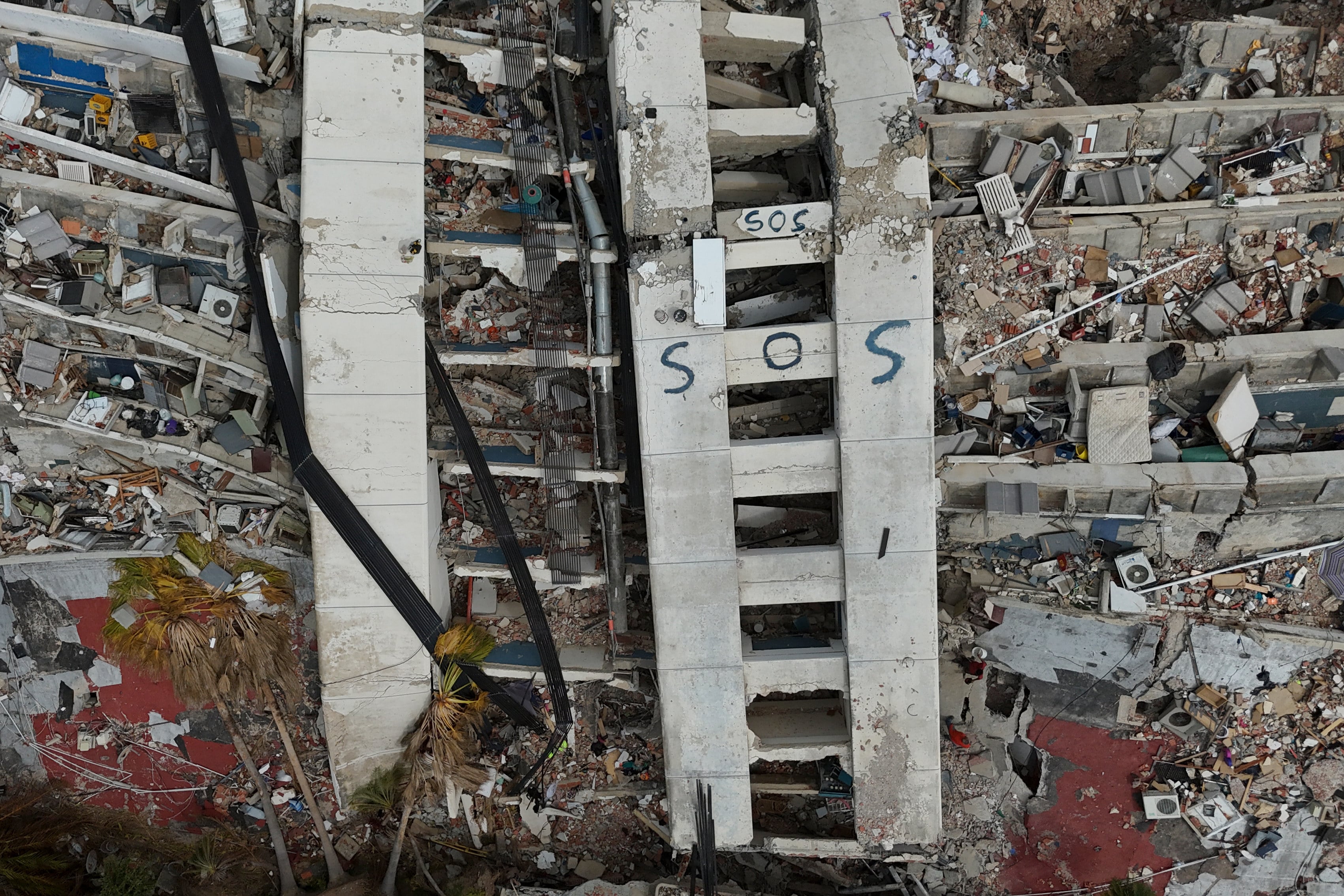 A destroyed building marked with 'SOS'. Photo: AP