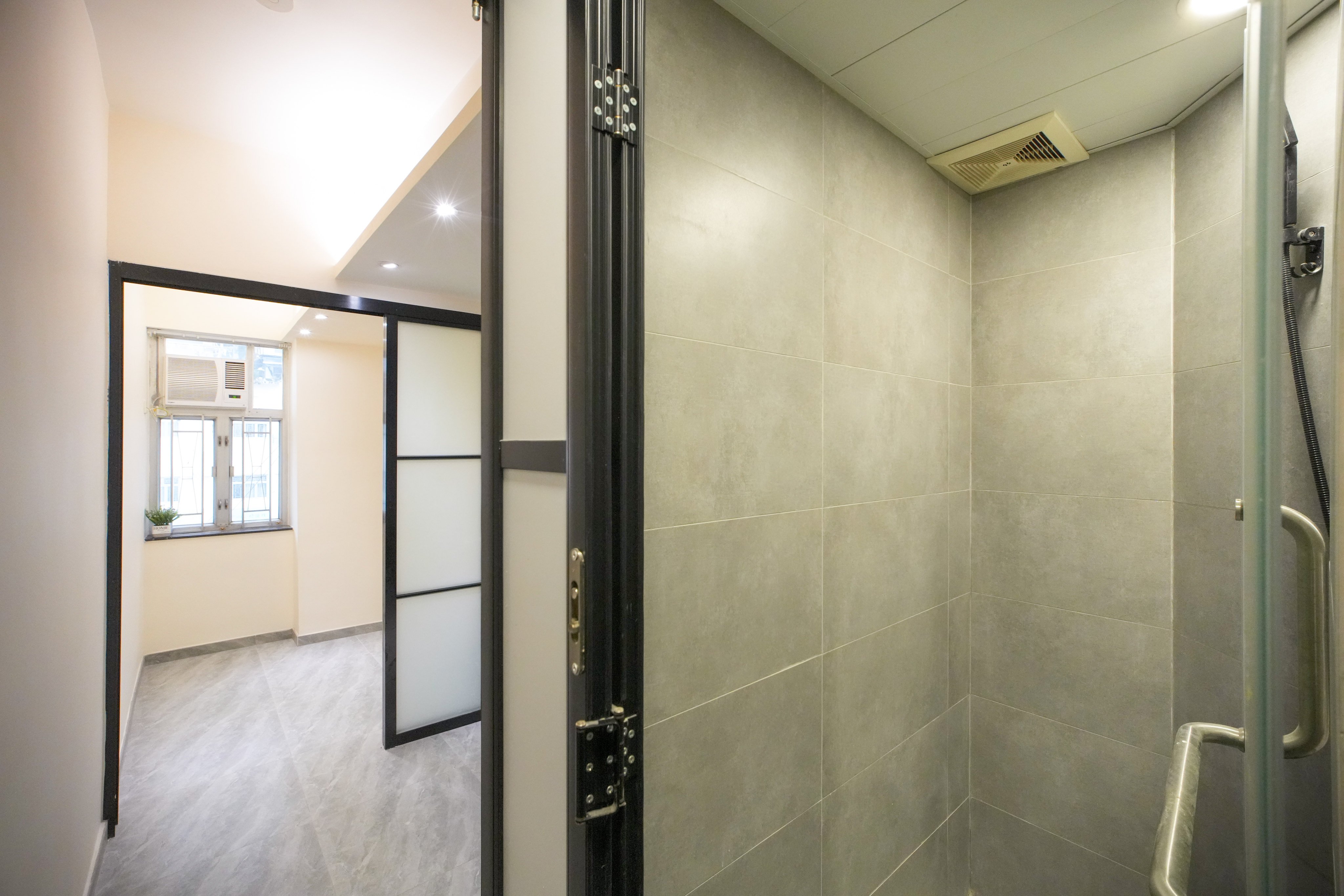 Interior view of a certified basic housing unit meeting minimum standards, including ventilation and fire safety, at Tsung Nga Building in Sham Shui Po. Photo: Dickson Lee