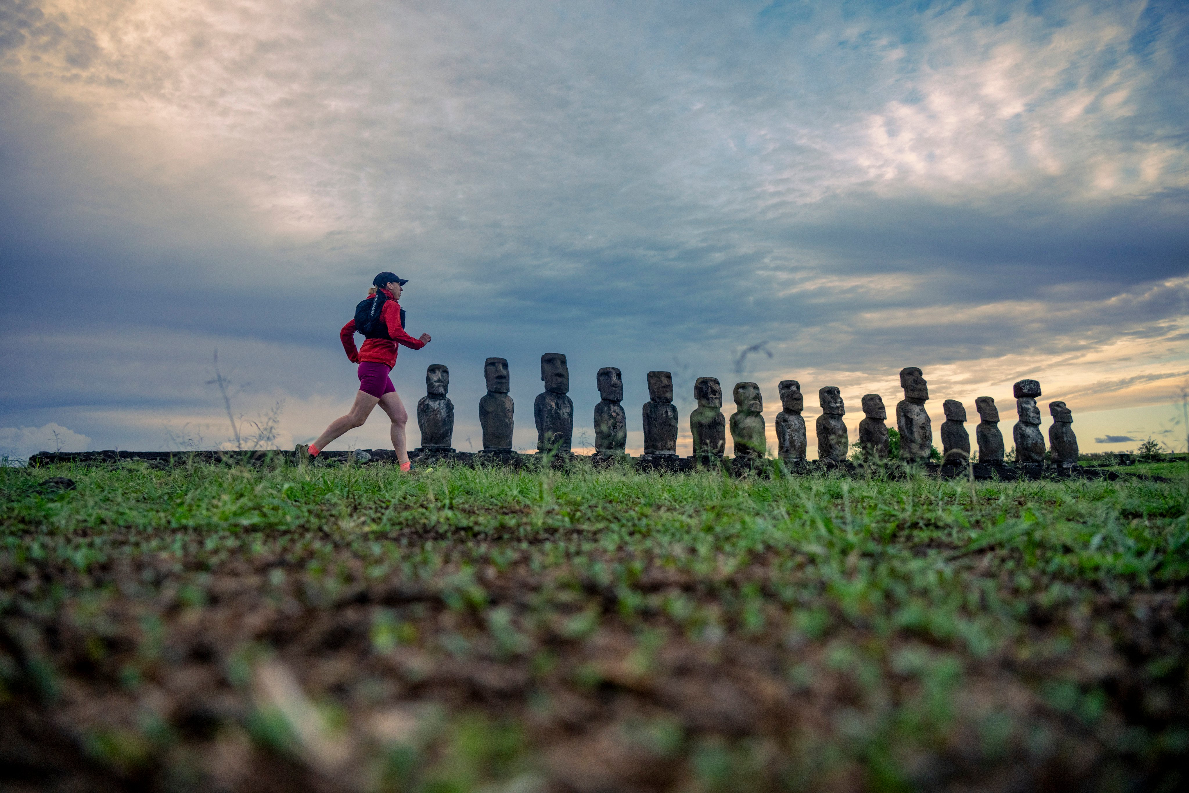 Writer Lily Canter runs past 15 moai statues at Ahu Tongariki, the most famous point on Easter Island, or  Rapa Nui, during her five-day tour organised by Rat Race. Photo: Leo Francis/Rat Race