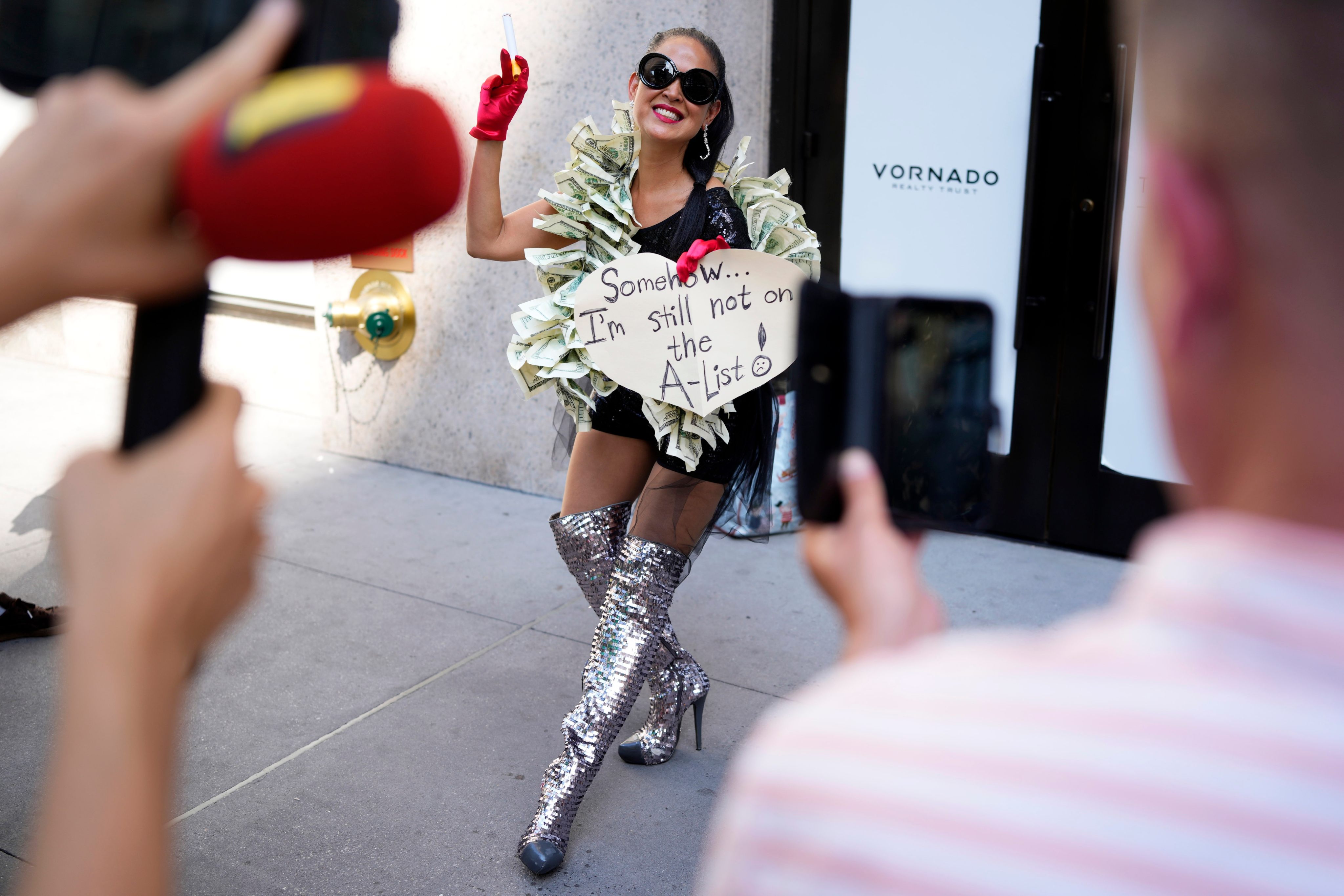 A fan poses for photos outside Madison Square Garden on Friday. Photo: AP