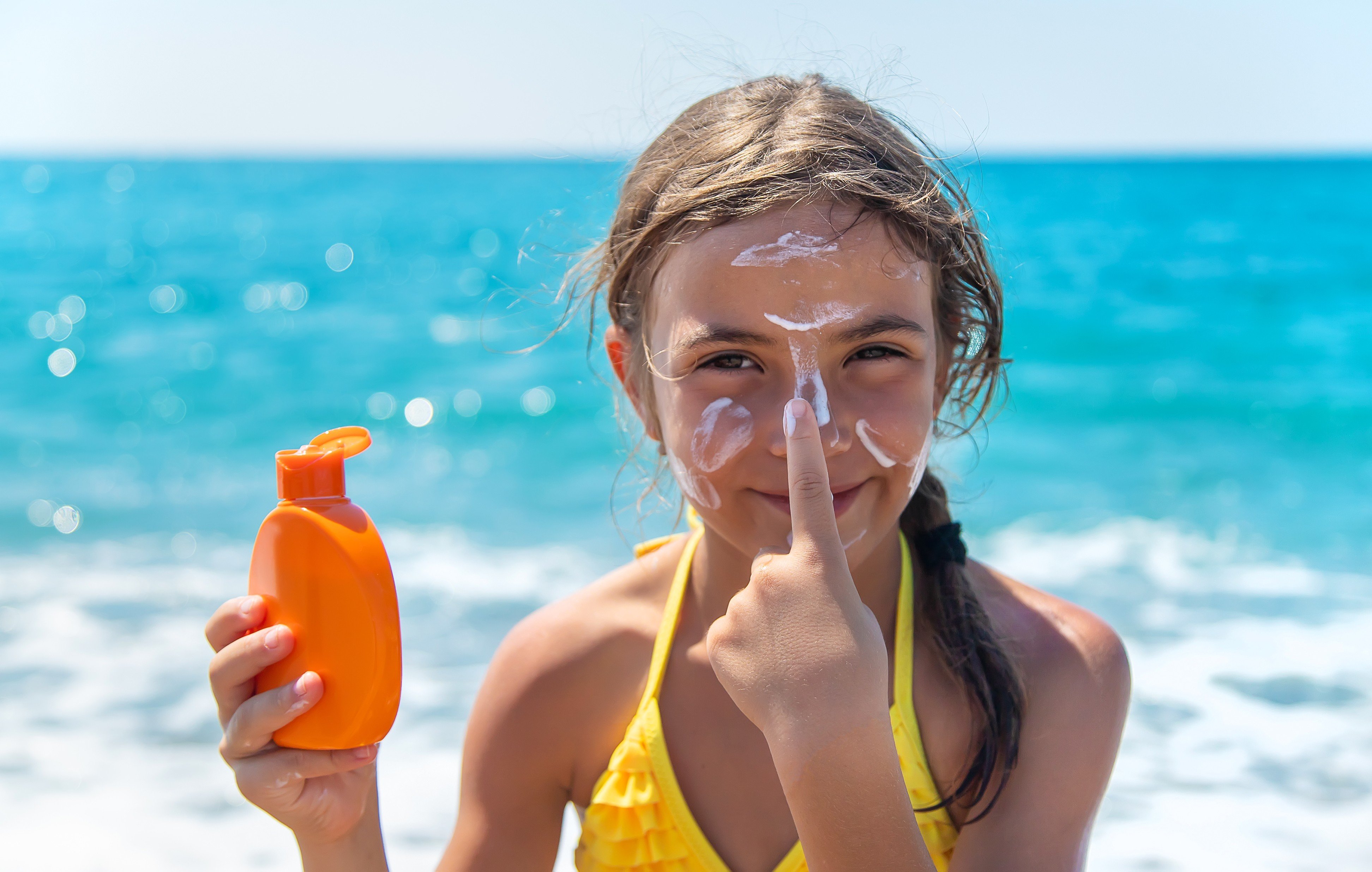 Children should wear sunscreen with a high SPF and UVA protection, and should reapply regularly, according to a dermatologist and a cancer research expert, who explain why sunburn is so dangerous for children and how to protect them. Photo: Shutterstock