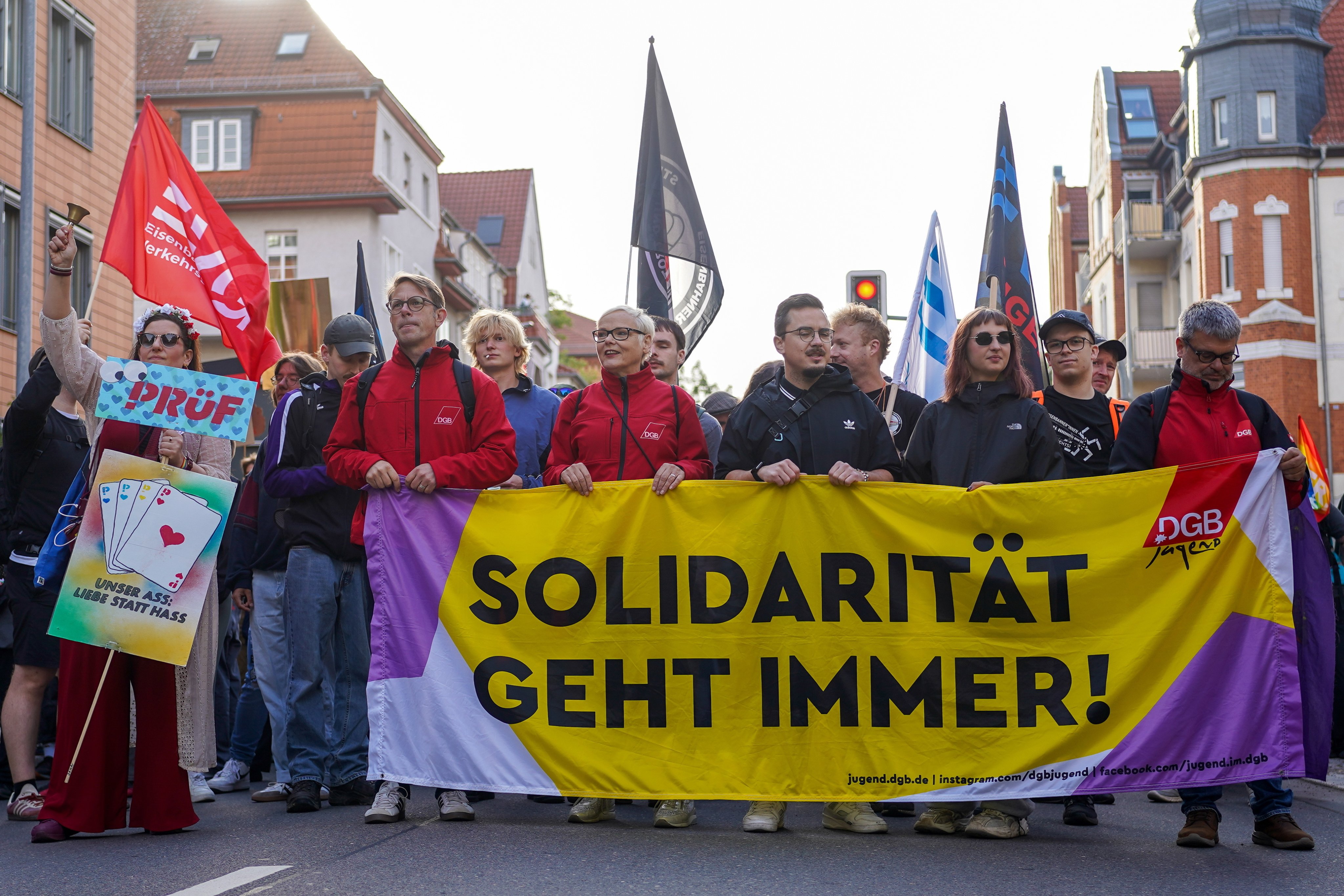 Demonstrators hold a banner reading “Solidarity is always important” as they gather in front of the main station ahead of the AfD federal party congress in Erfurt, Germany, on Saturday. Photo: EPA