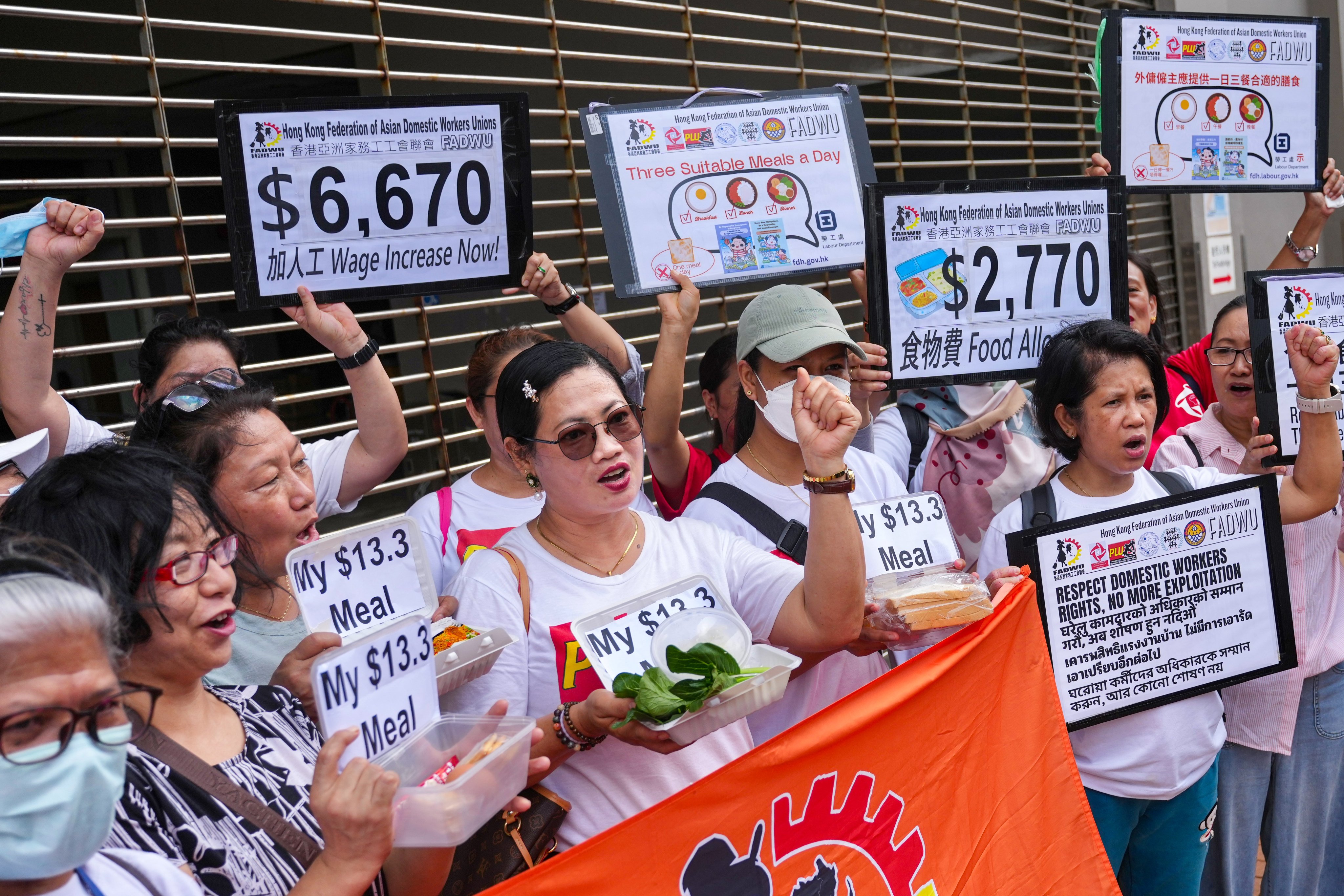 Members of the Hong Kong Federation of Asian Domestic Workers Unions protest outside Harbour Building in Central. Photo: Karma Lo