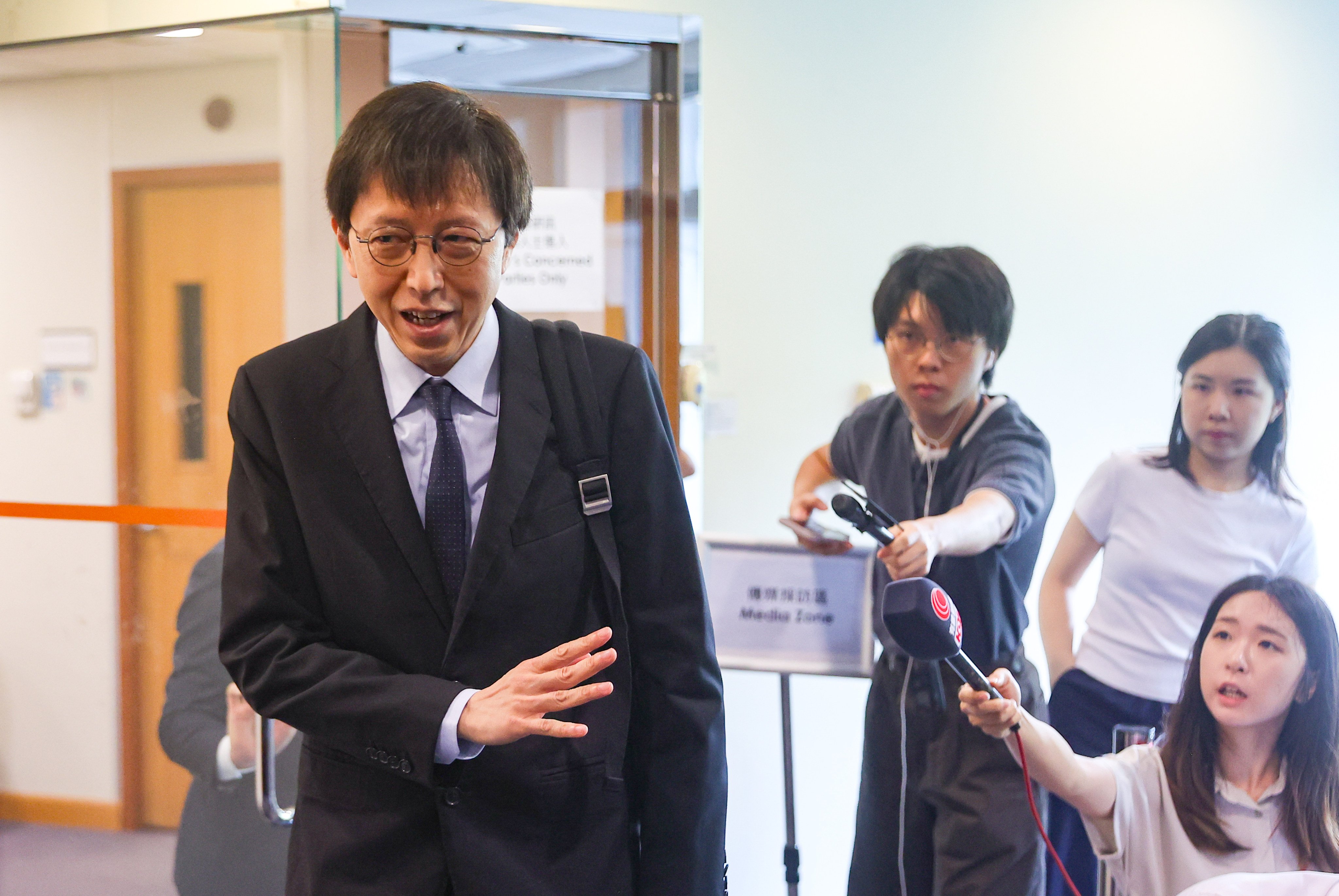 Doctor Sit Sou-chi leaves after the medical hearing after being removed from the General Register for nine months over his handling of a newborn’s seizure that left a boy disabled for life. Photo: Edmond So