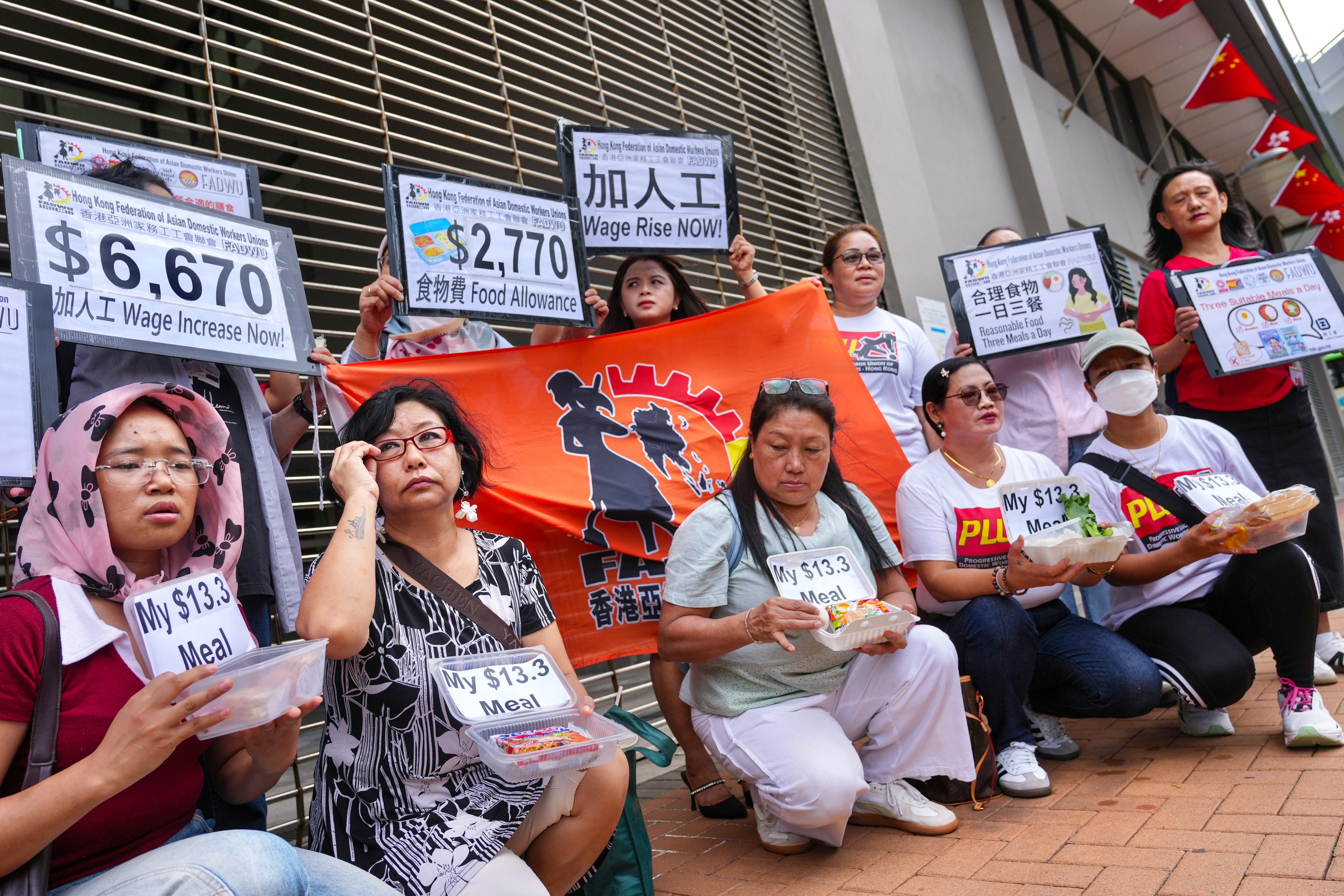Members of the Hong Kong Federation of Asian Domestic Workers Unions protest outside Harbour Building in Central. Photo: Karma Lo