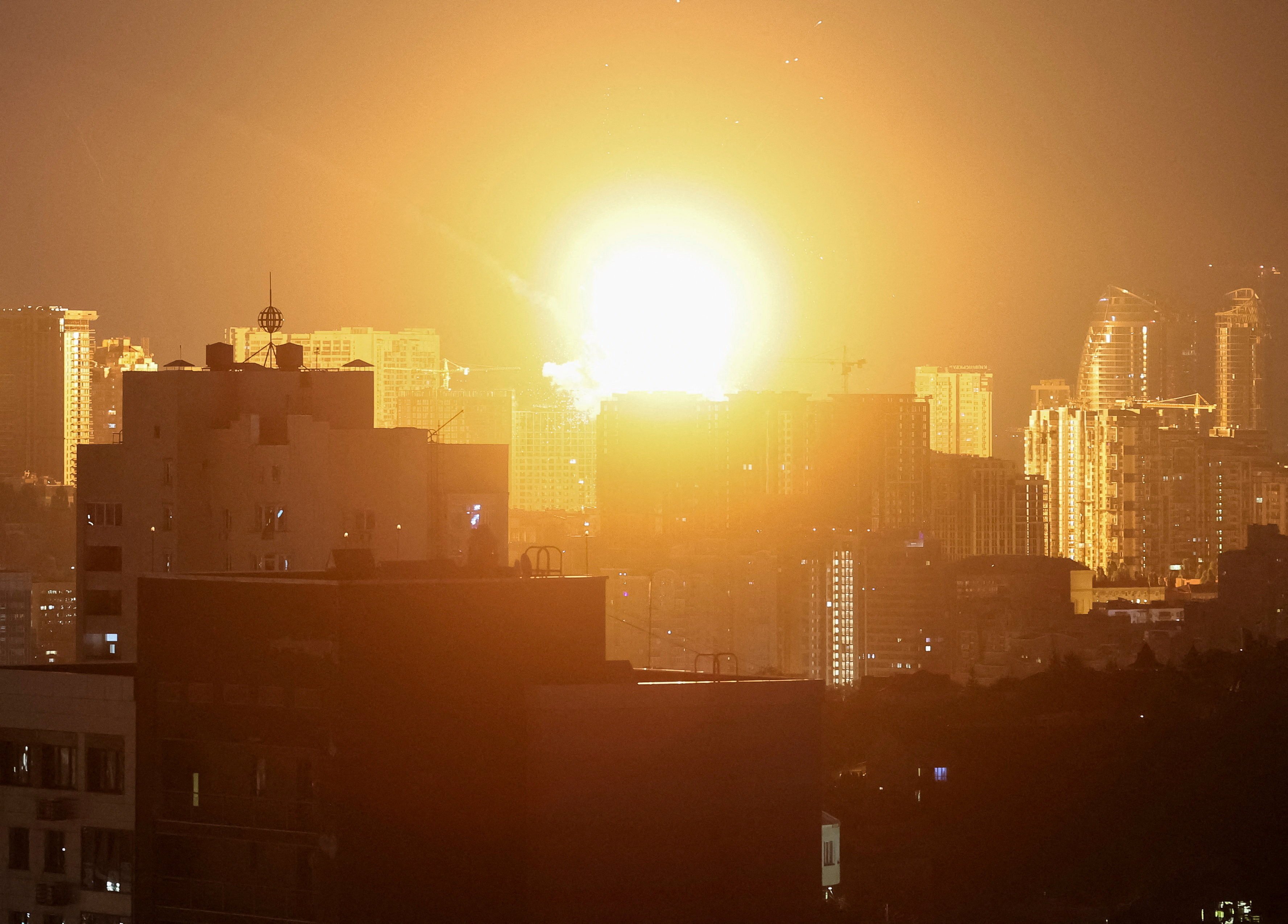 An explosion lights up the sky over Kyiv. Photo: Reuters