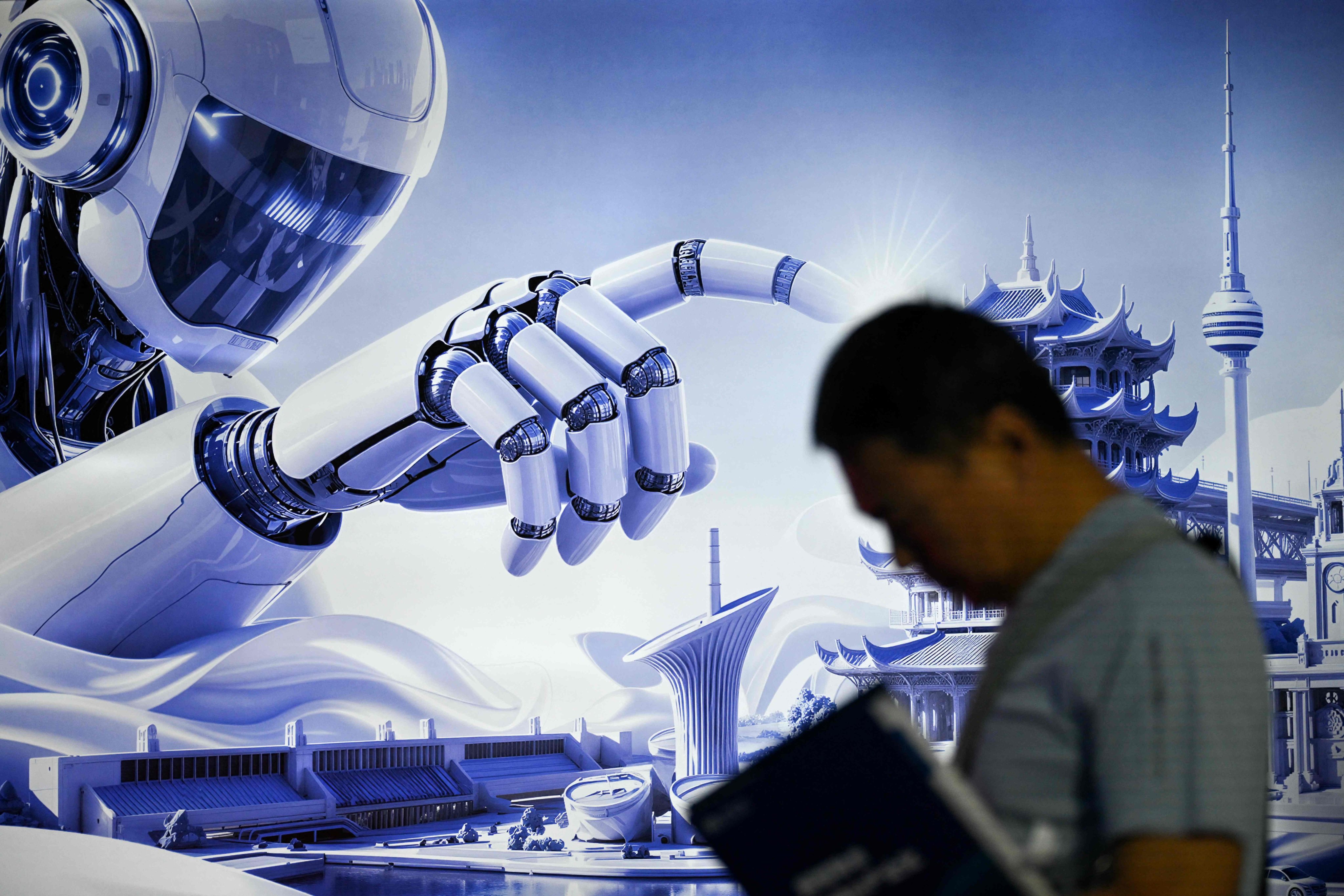 A man stands next to a poster of a humanoid robot during the China International Supply Chain Expo in Beijing on June 25, 2026. Photo: AFP
