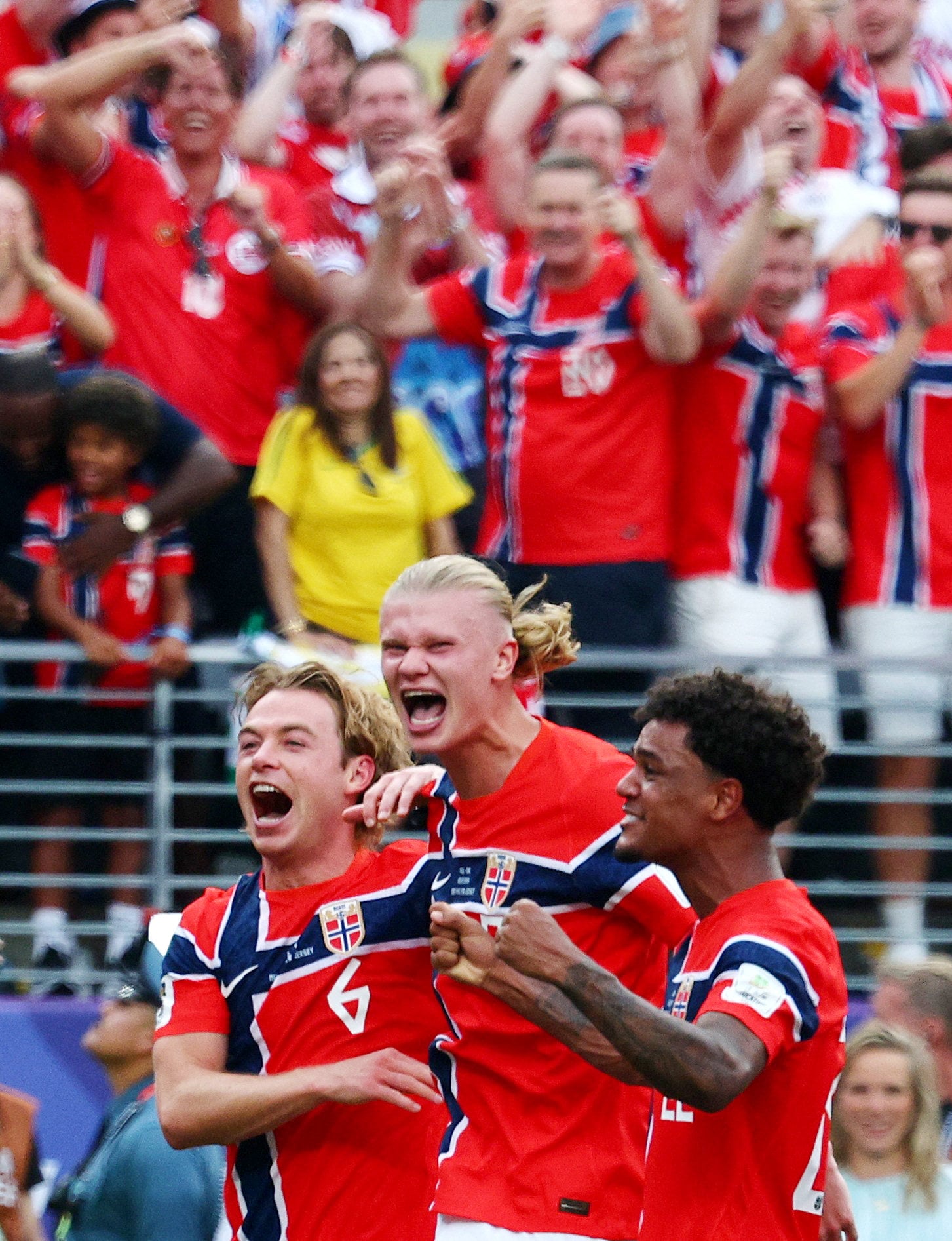 Norway’s Erling Haaland (cente) celebrates with teammates Patrick Berg (left) and Oscar Bobb after their stunning win. Photo: Reuters
