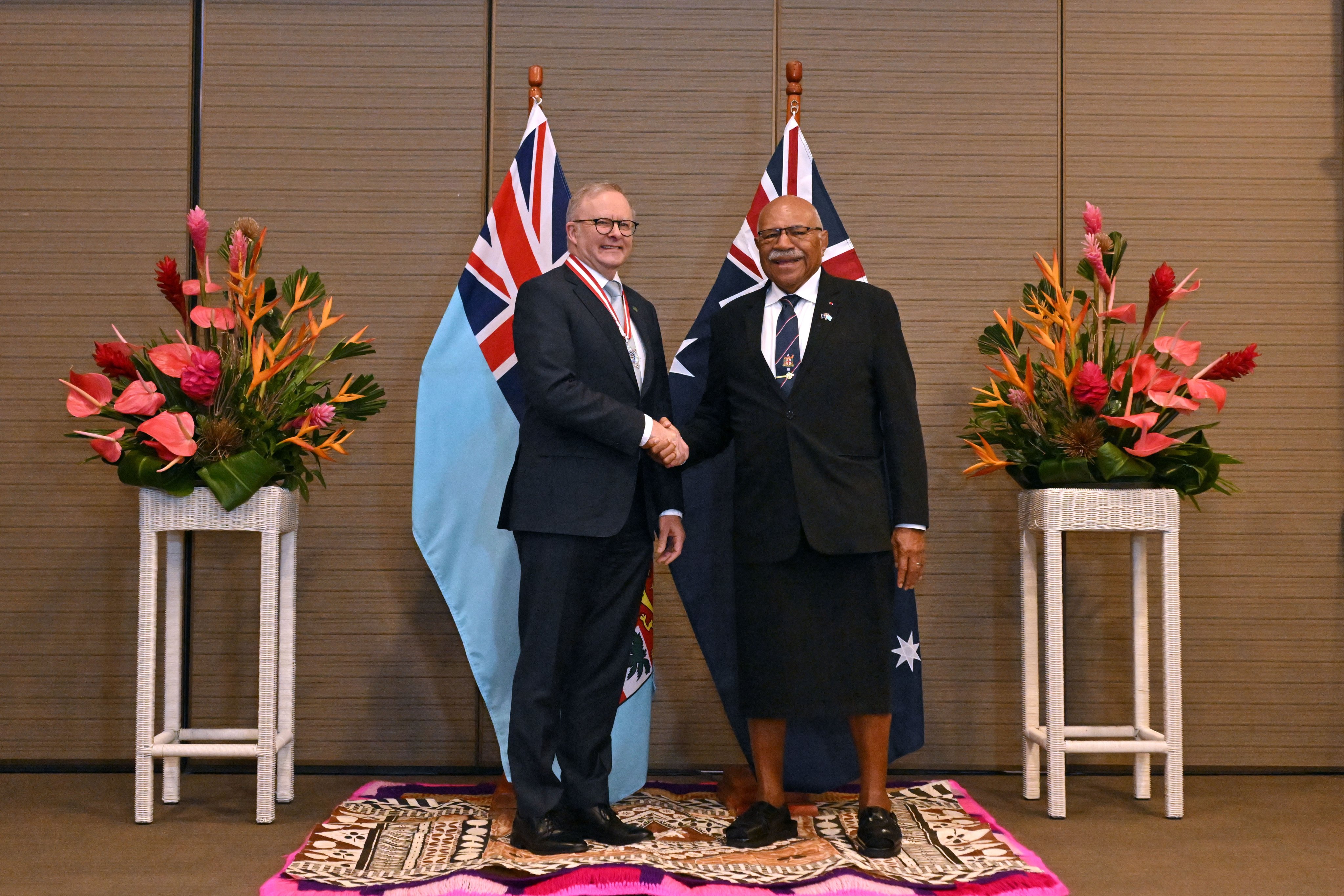Prime ministers of Australia, Anthony Albanese (left), and Fiji, Sitiveni Rabuka, shake hands after signing a treaty in Suva on Monday. Photo: EPA