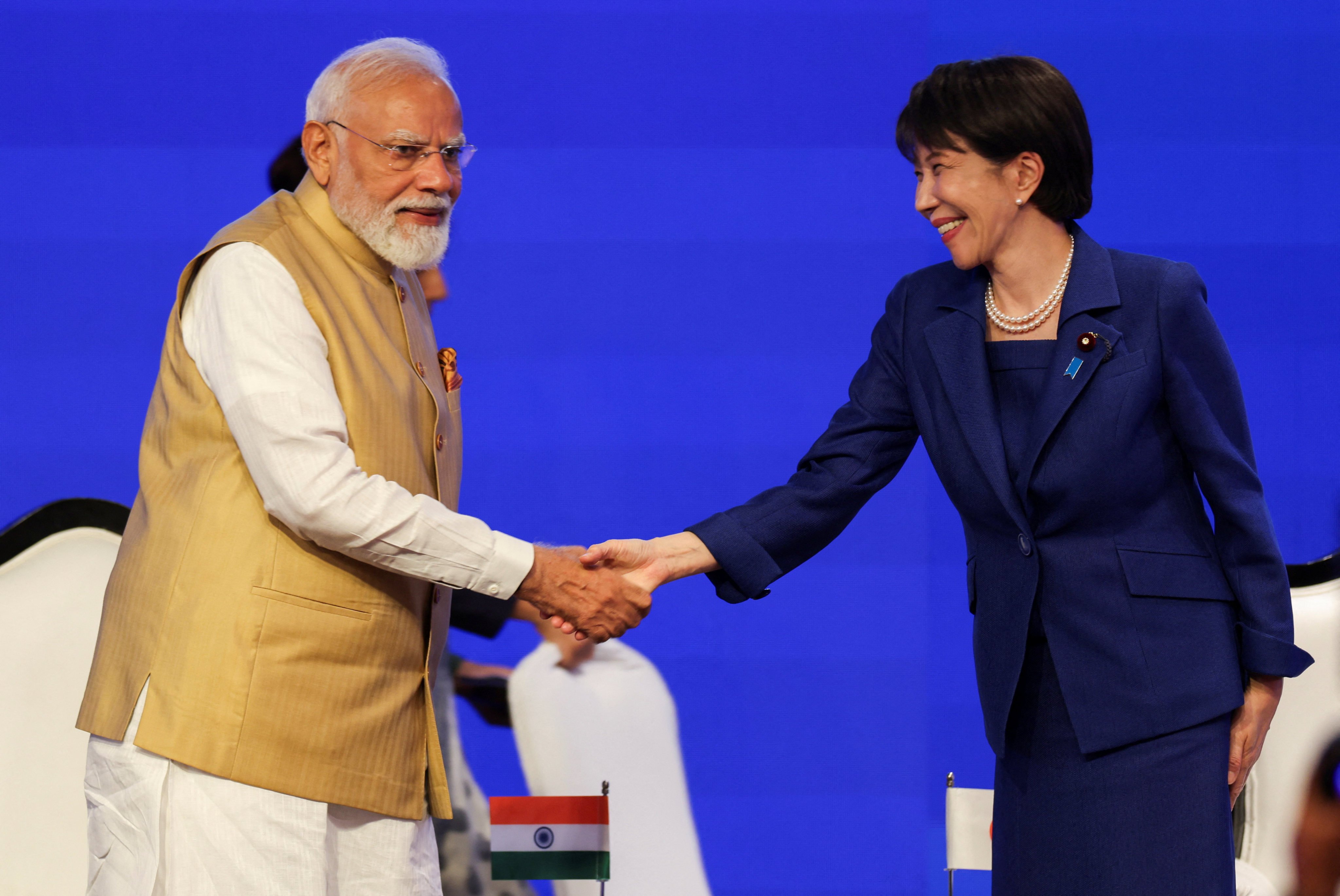 Indian Prime Minister Narendra Modi shakes hands with his Japanese counterpart Sanae Takaichi at an economic forum in New Delhi on Thursday. Photo: Reuters.