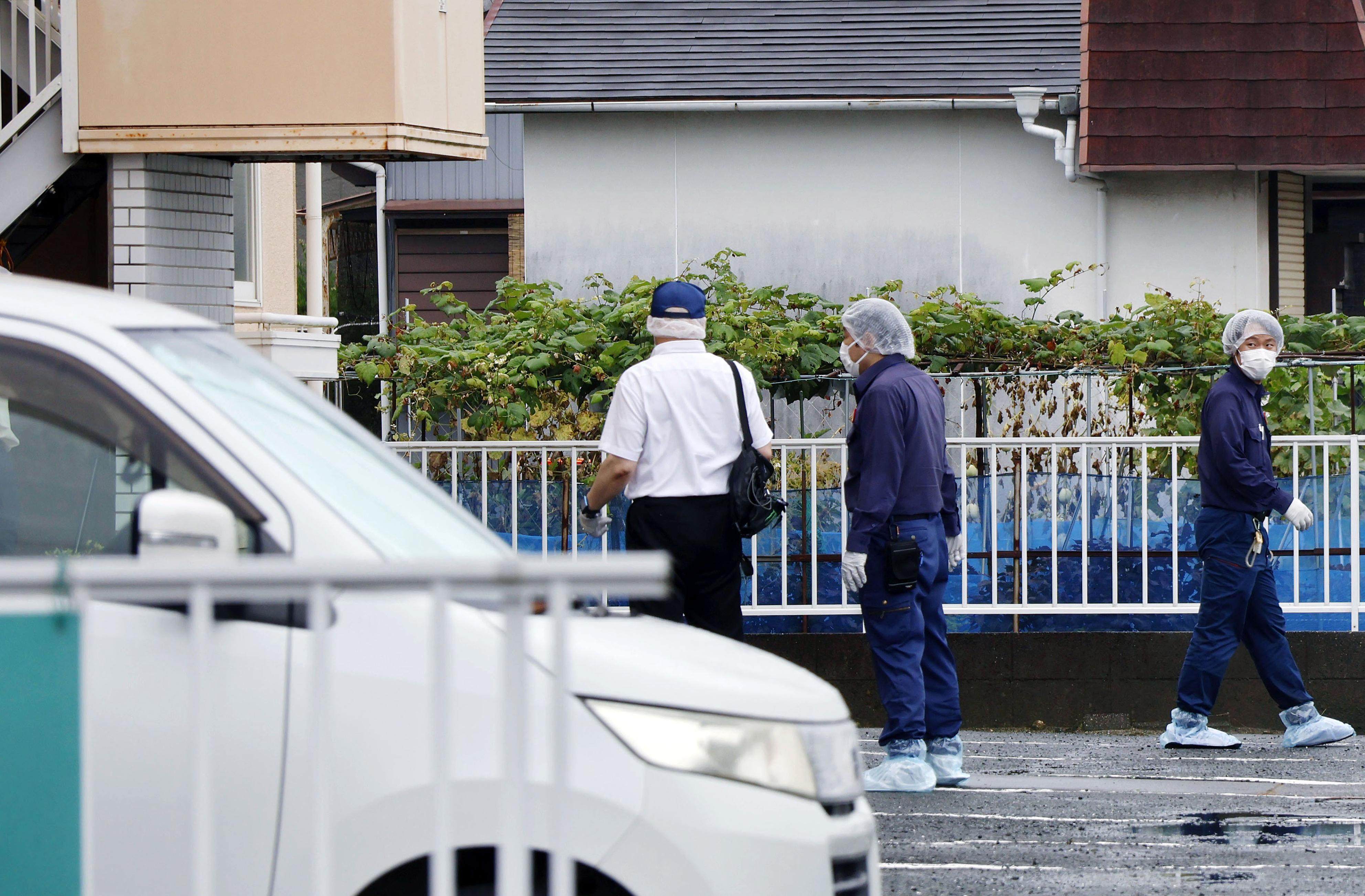 Investigators search near a flat where a woman was fatally stabbed in  Japan’s Hamamatsu, Shizuoka Prefecture, on Monday. Photo: Kyodo