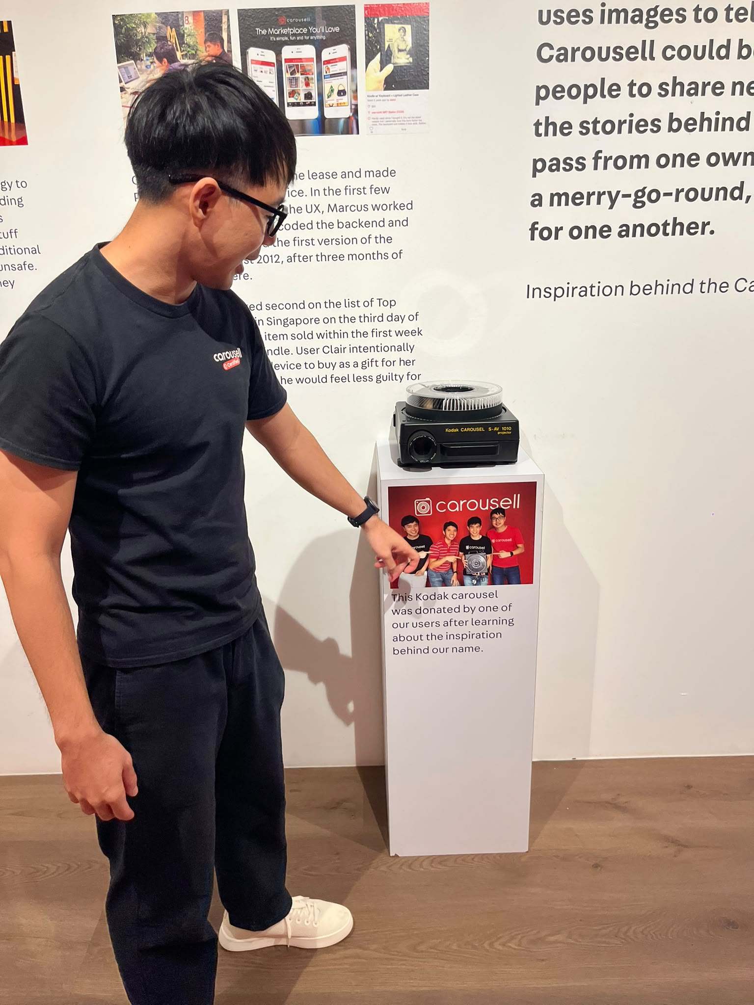 Carousell co-founder Marcus Tan points to a Kodak carousel projector, gifted to them by a platform user, on display in the company’s Singapore office. Photo: Jean Iau
