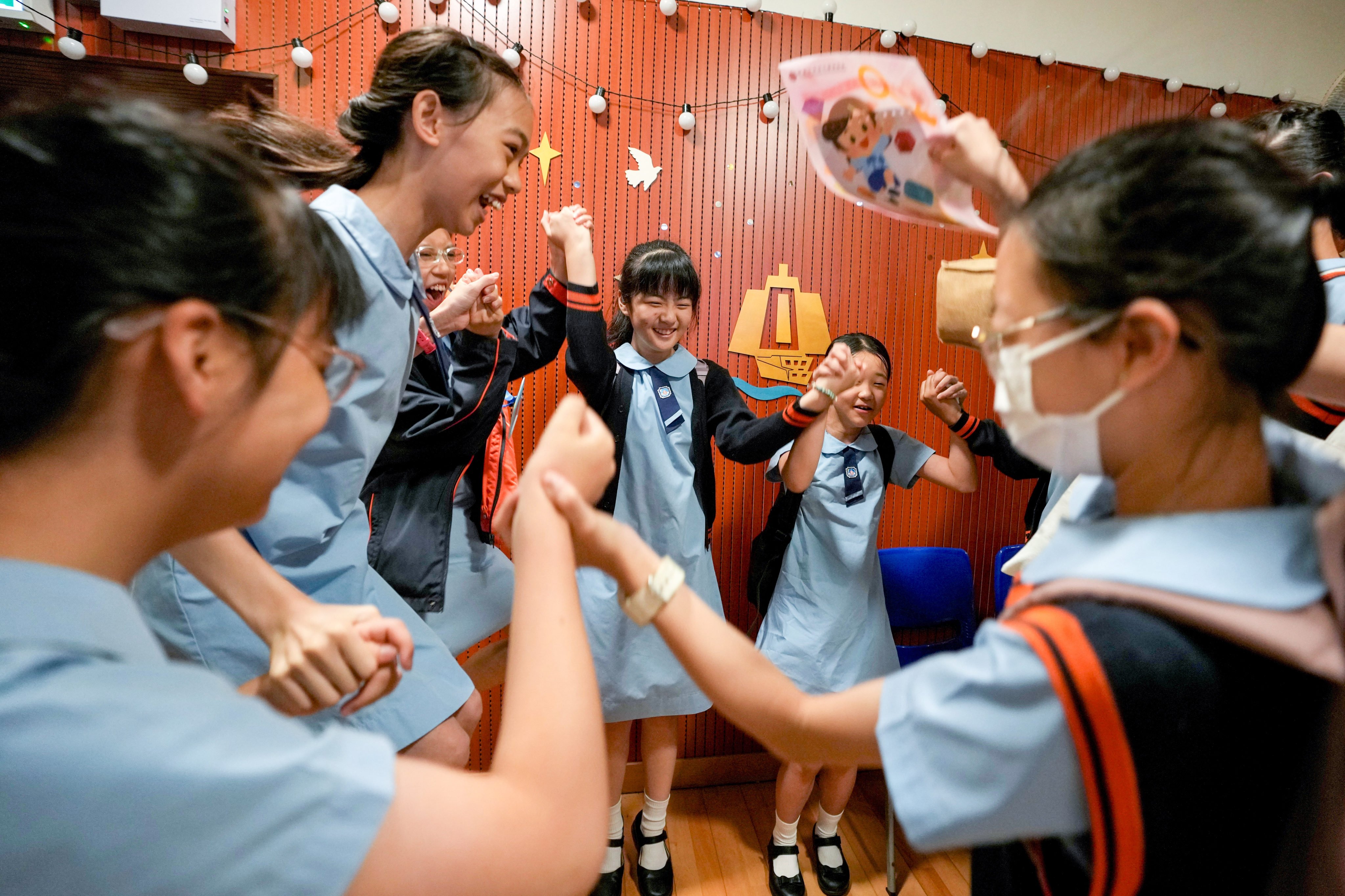 Pupils at Yaumati Catholic Primary School (Hoi Wang Road) celebrate their secondary school allocation results. Photo: Sam Tsang