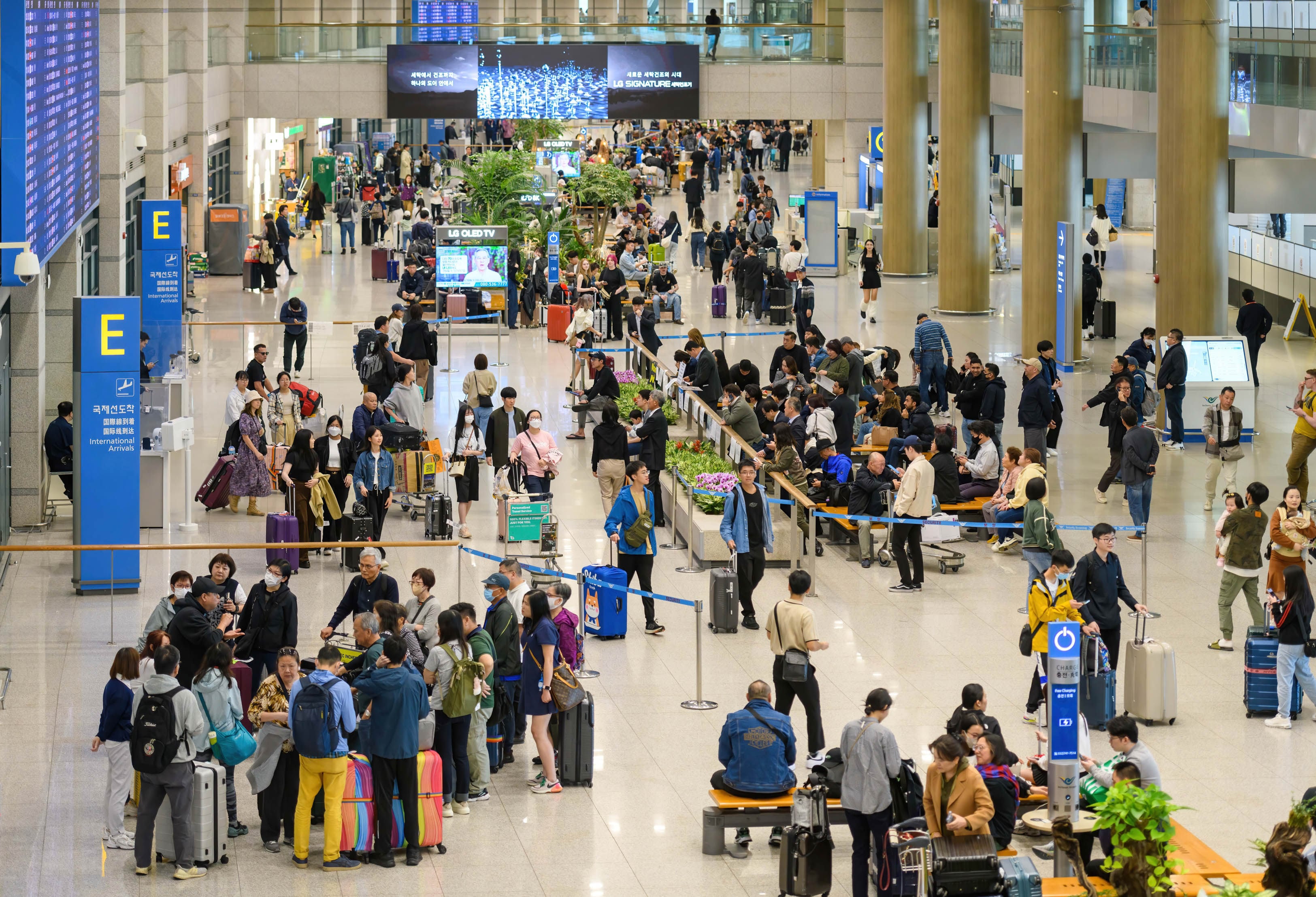 Passengers pass through Incheon International Airport in April 2024. Photo: Getty Images