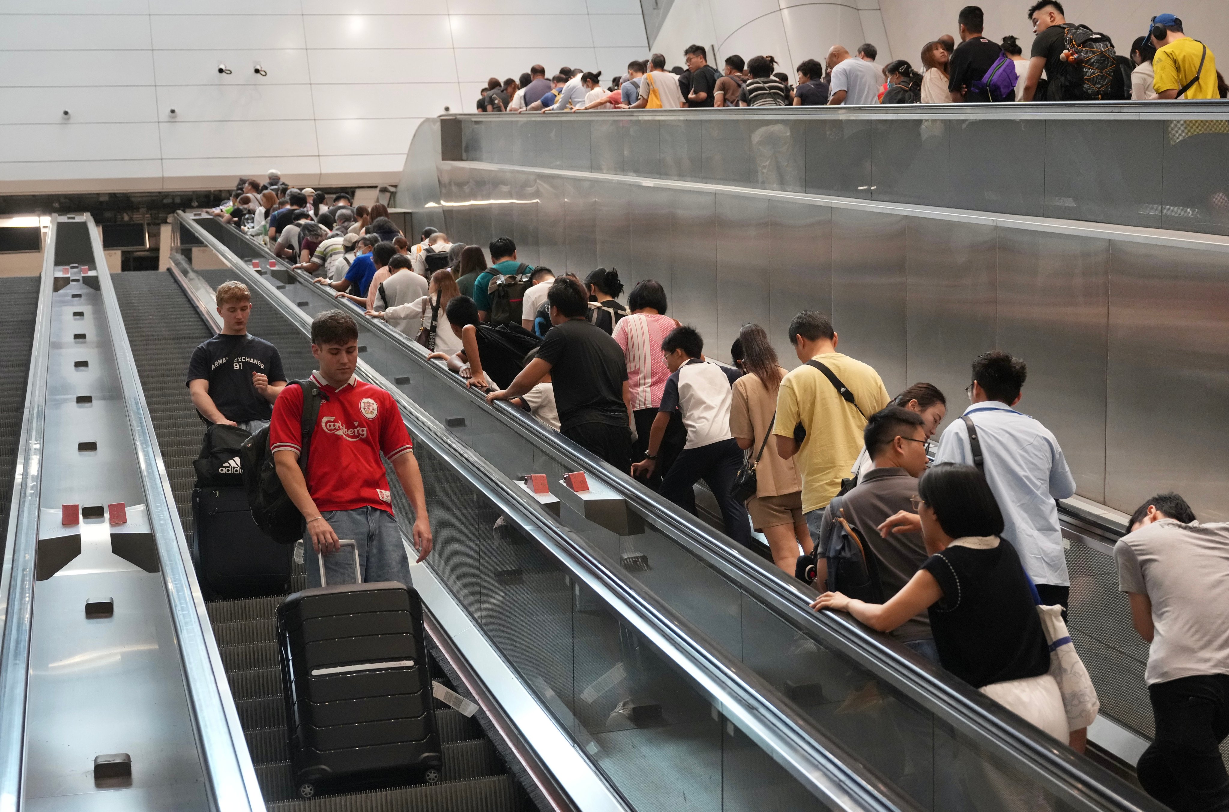 Passengers at Admiralty station. The MTR Corp reported 233 escalator-related accidents in the first half of the year. Photo: Karma Lo