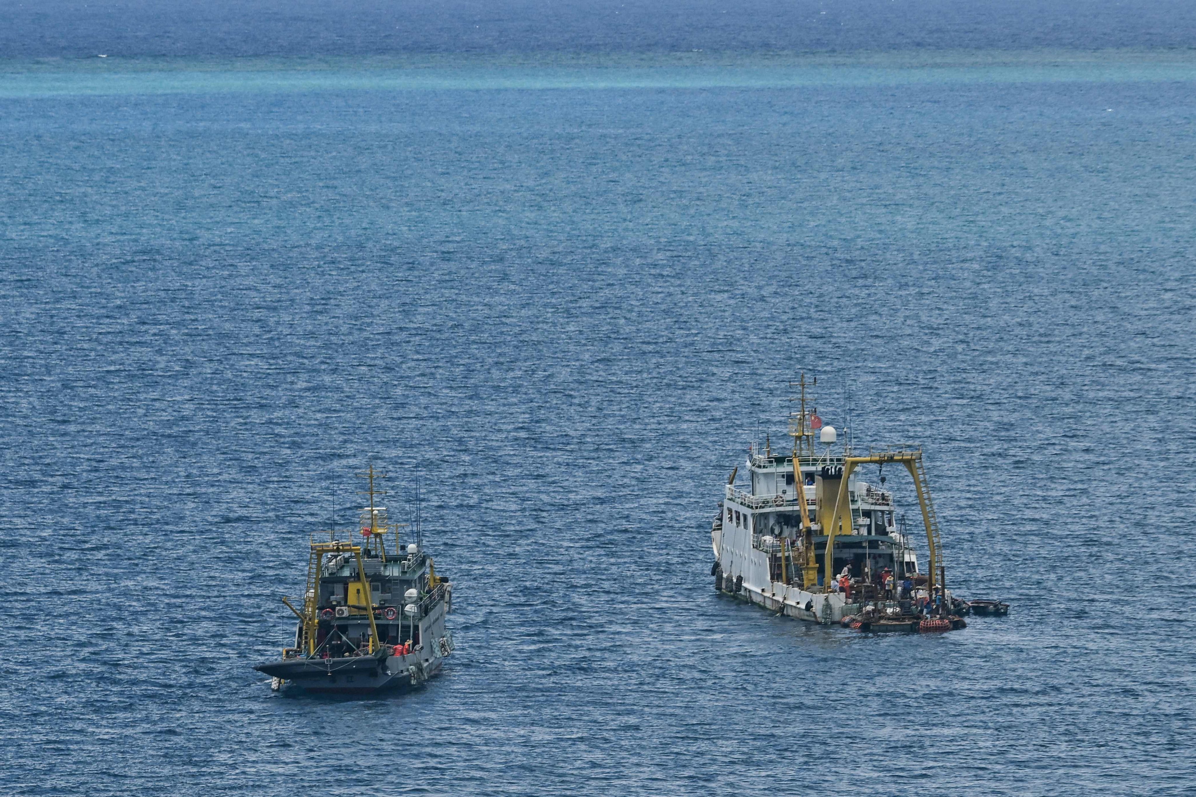 Ships identified by the Philippine Coast Guard as Chinese research vessels are seen at Scarborough Shoal in the disputed South China Sea on June 15. Photo: AFP