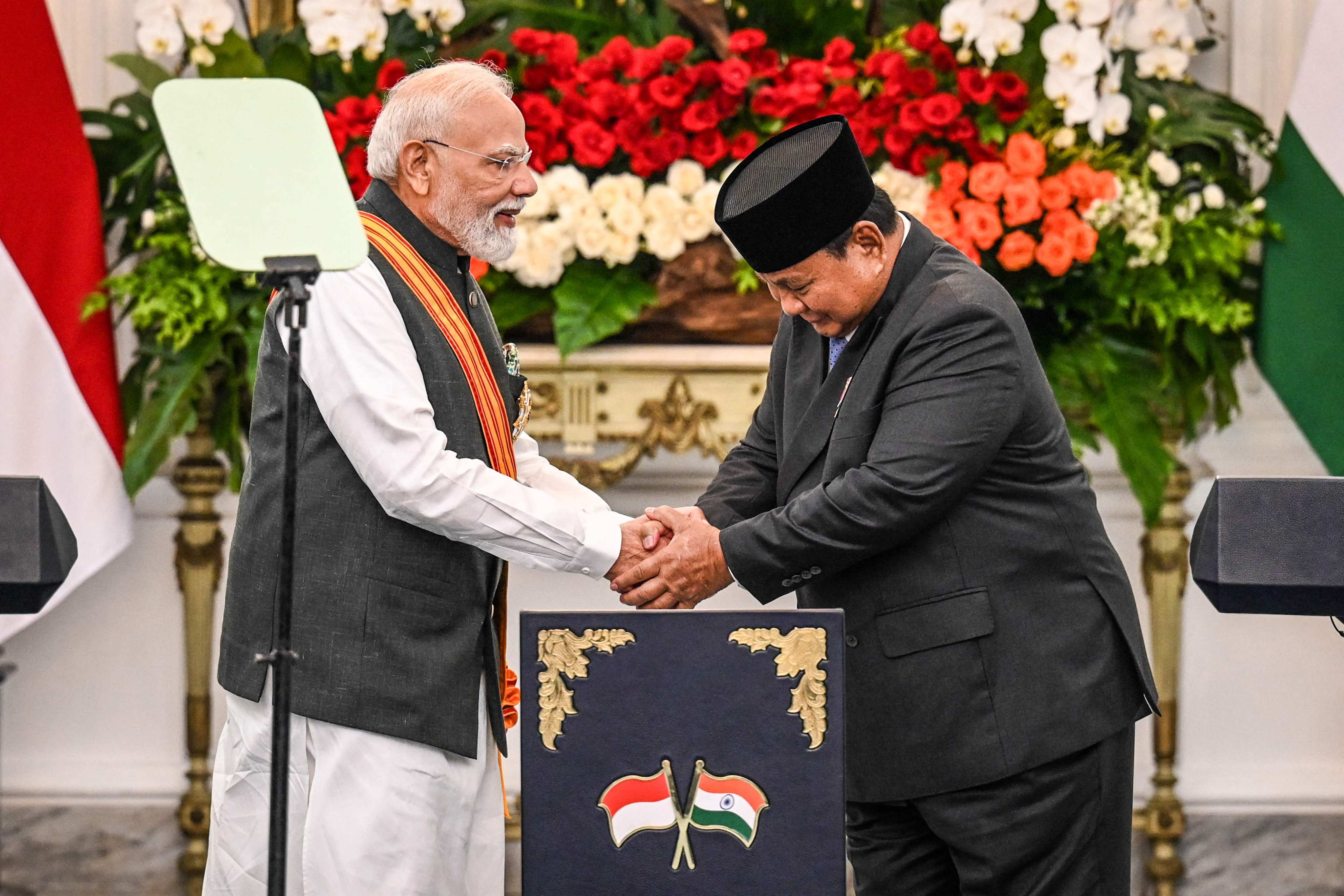 Indias Prime Minister Narendra Modi and Indonesia’s President Prabowo Subianto shake hands after attending a joint press conference at the Merdeka Palace in Jakarta on Tuesday. Photo: AFP