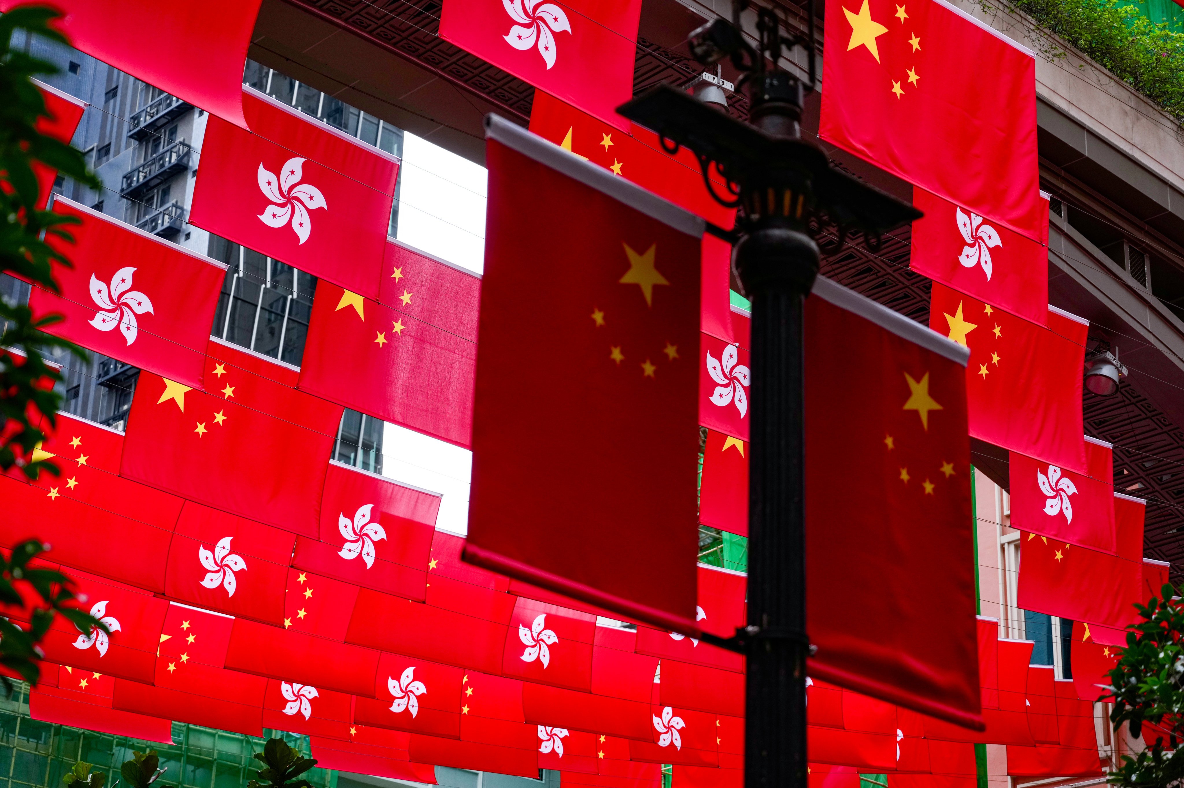 Local and national flags. The defendant claimed that only Taipei had lawful sovereignty over Hong Kong. Photo: Karma Lo