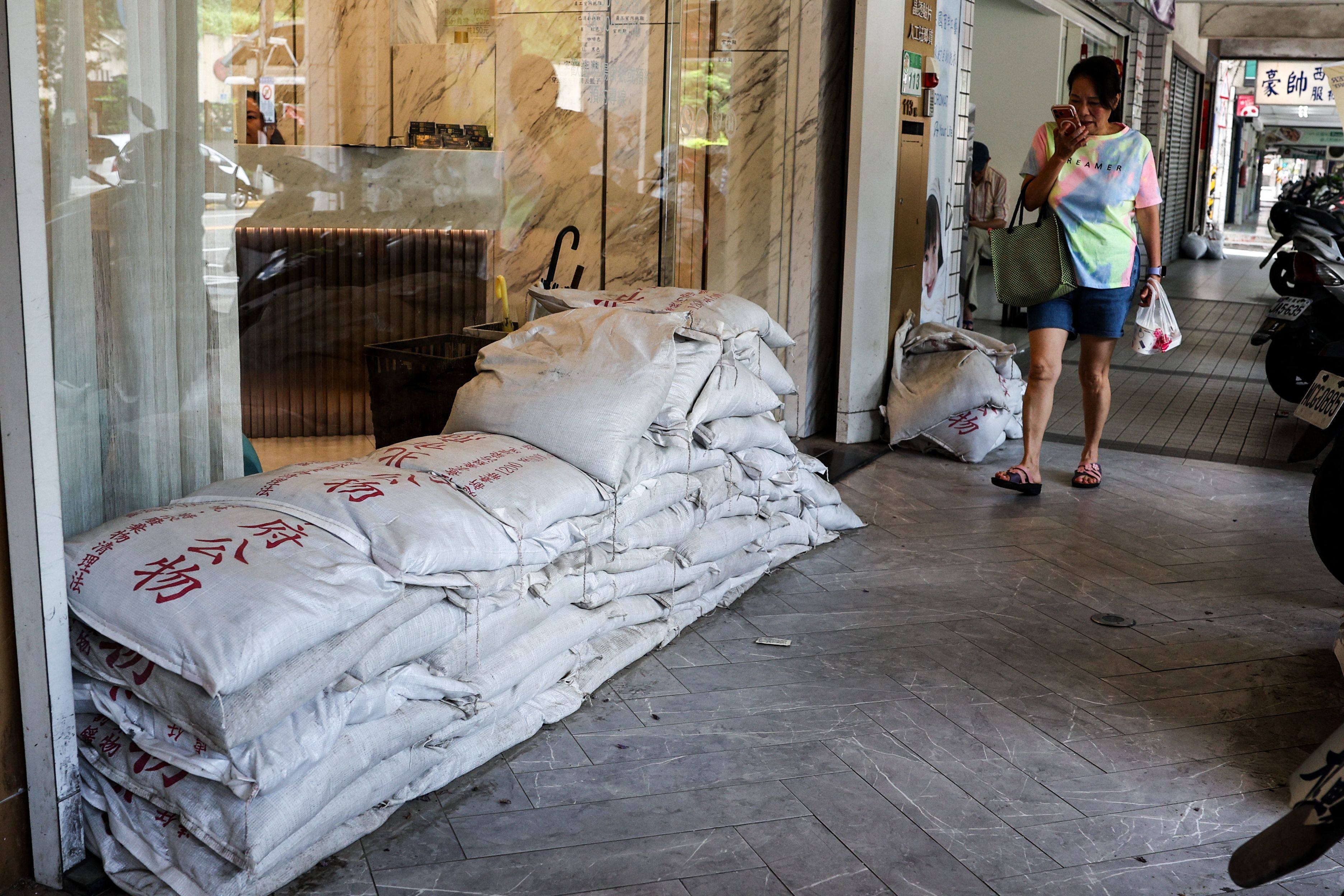 Sandbags are stacked outside a building in Taipei in preparation for the super typhoon. Photo: AFP