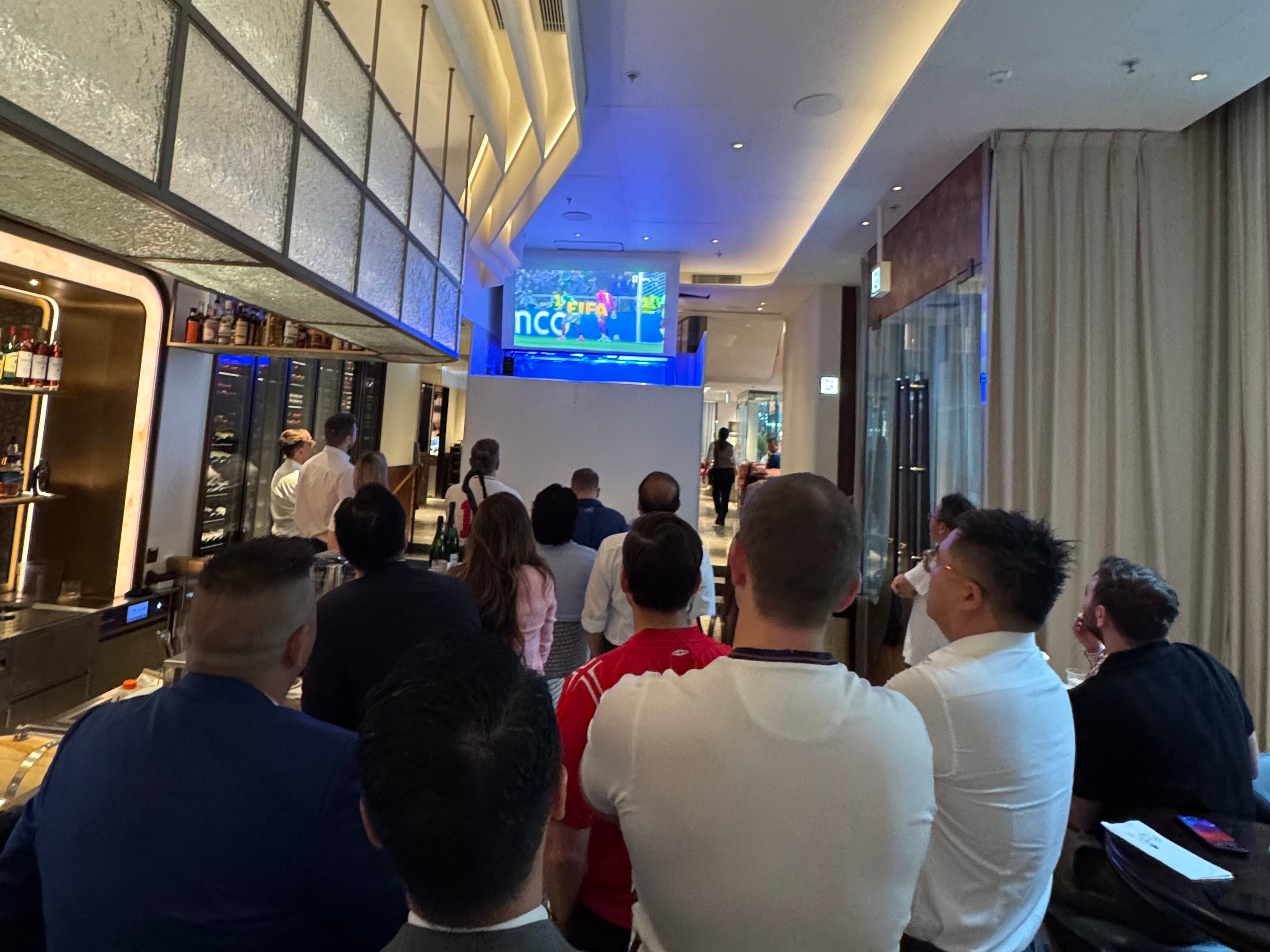 Fans watch England’s World Cup match against Mexico inside Dot Cod in Hong Kong’s Central district on an early Monday morning in July 2026. Photo: Veronica Qi