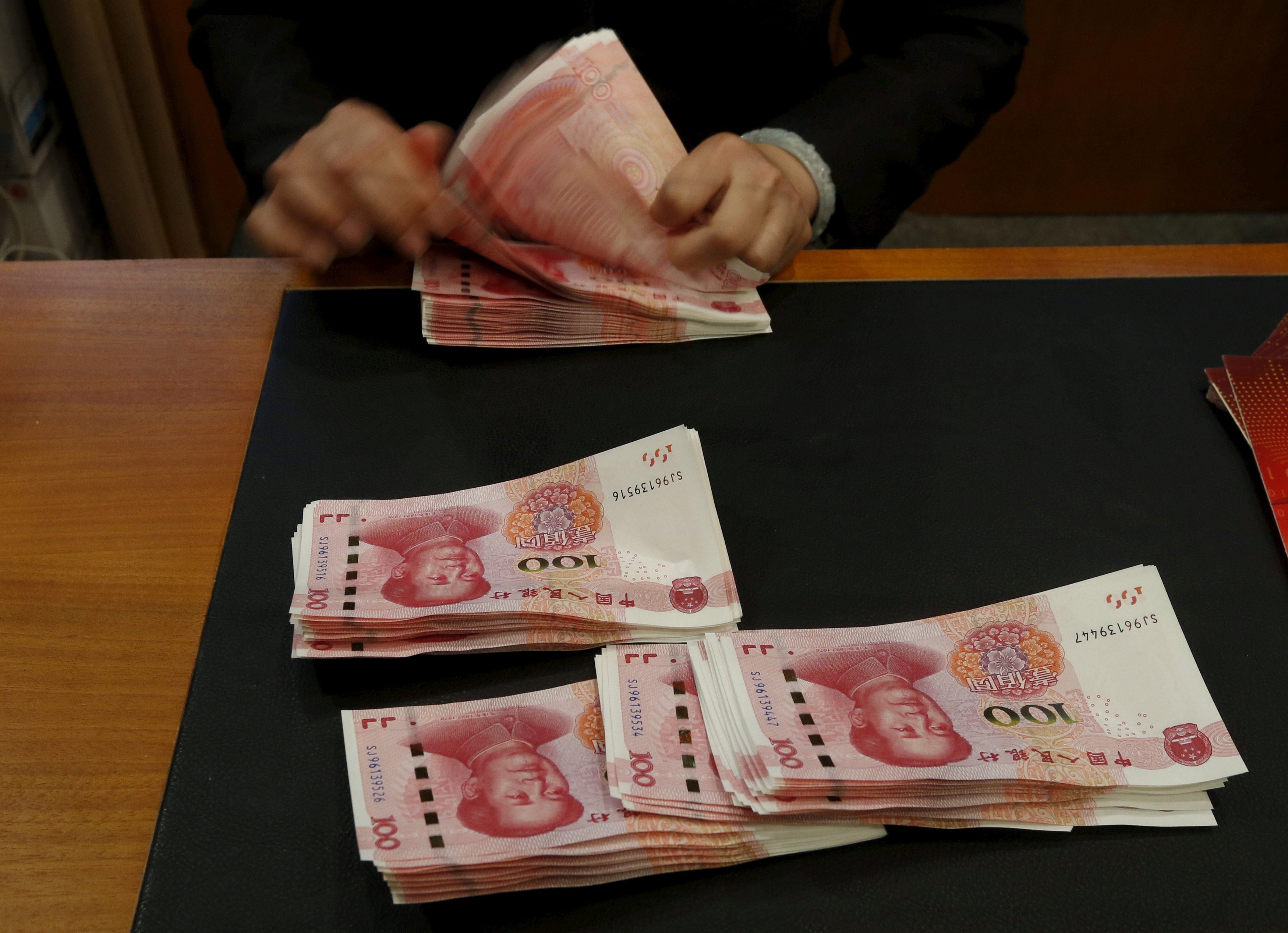 Chinese 100-yuan notes at a Bank of China branch in Hong Kong. Photo: Reuters