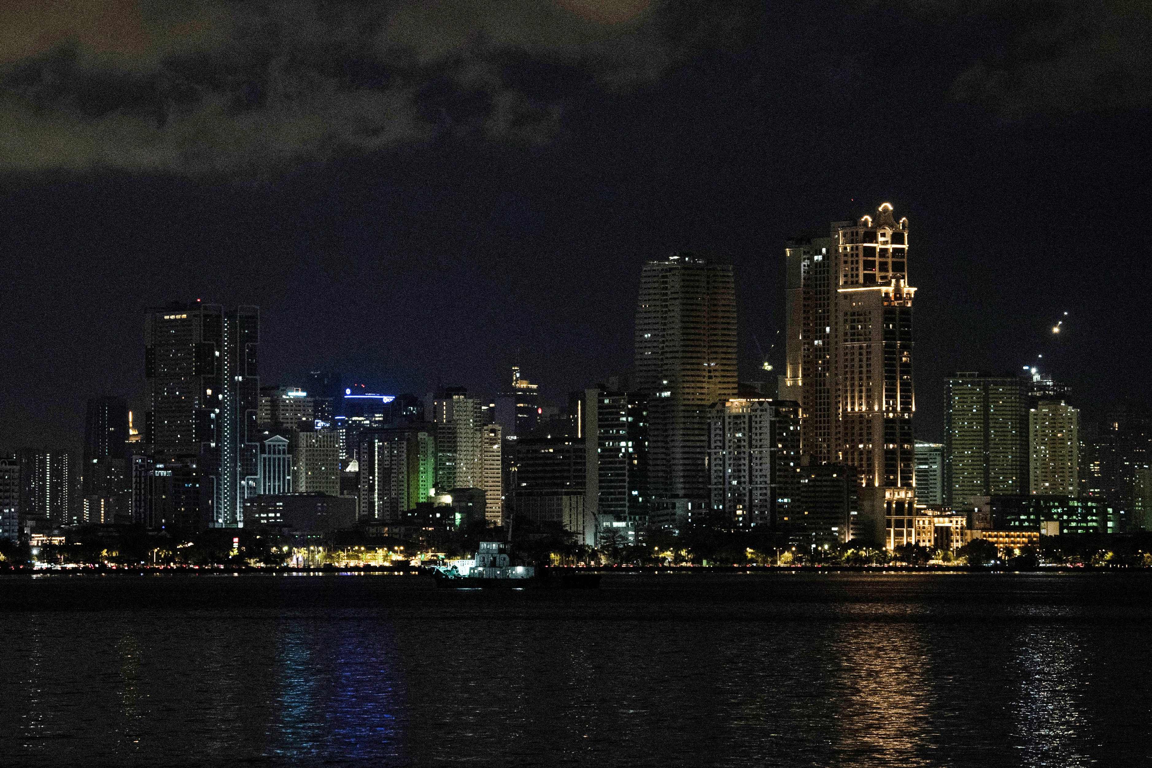 Manila’s skyline. The Philippines’ economic upgrade to upper-middle-income status contrasts with citizens’ struggles with inflation. Photo: AFP