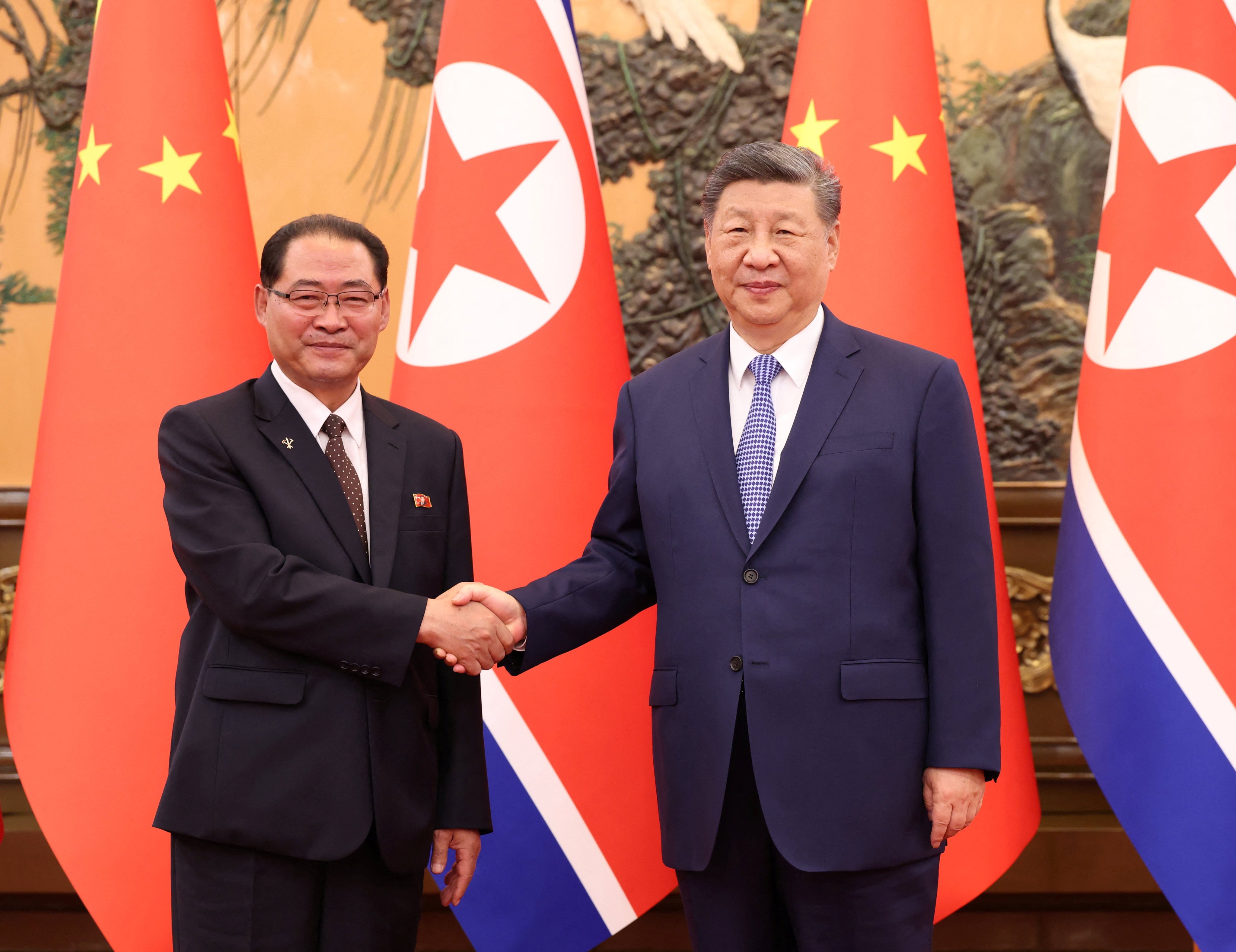 Chinese President Xi Jinping (right) and North Korean Premier Pak Thae-song meet in Beijing on Friday. Photo: Reuters