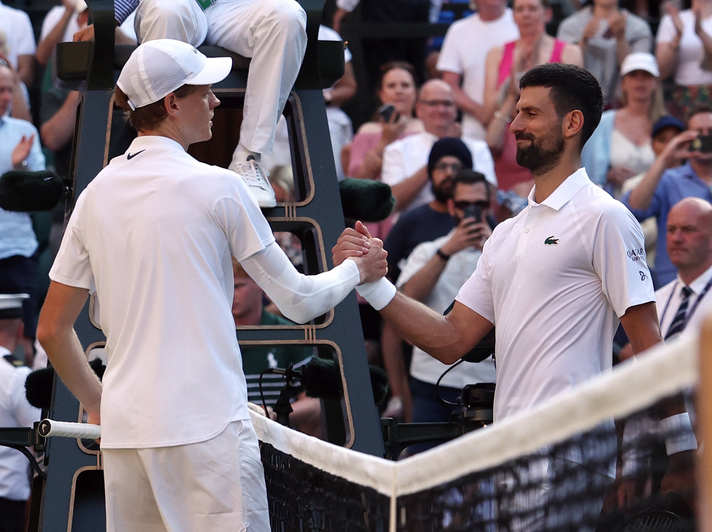 Eventual Wimbledon champion Jannik Sinner shakes hands with Novak Djokovic after winning their semi-final match last year. Photo: Reuters