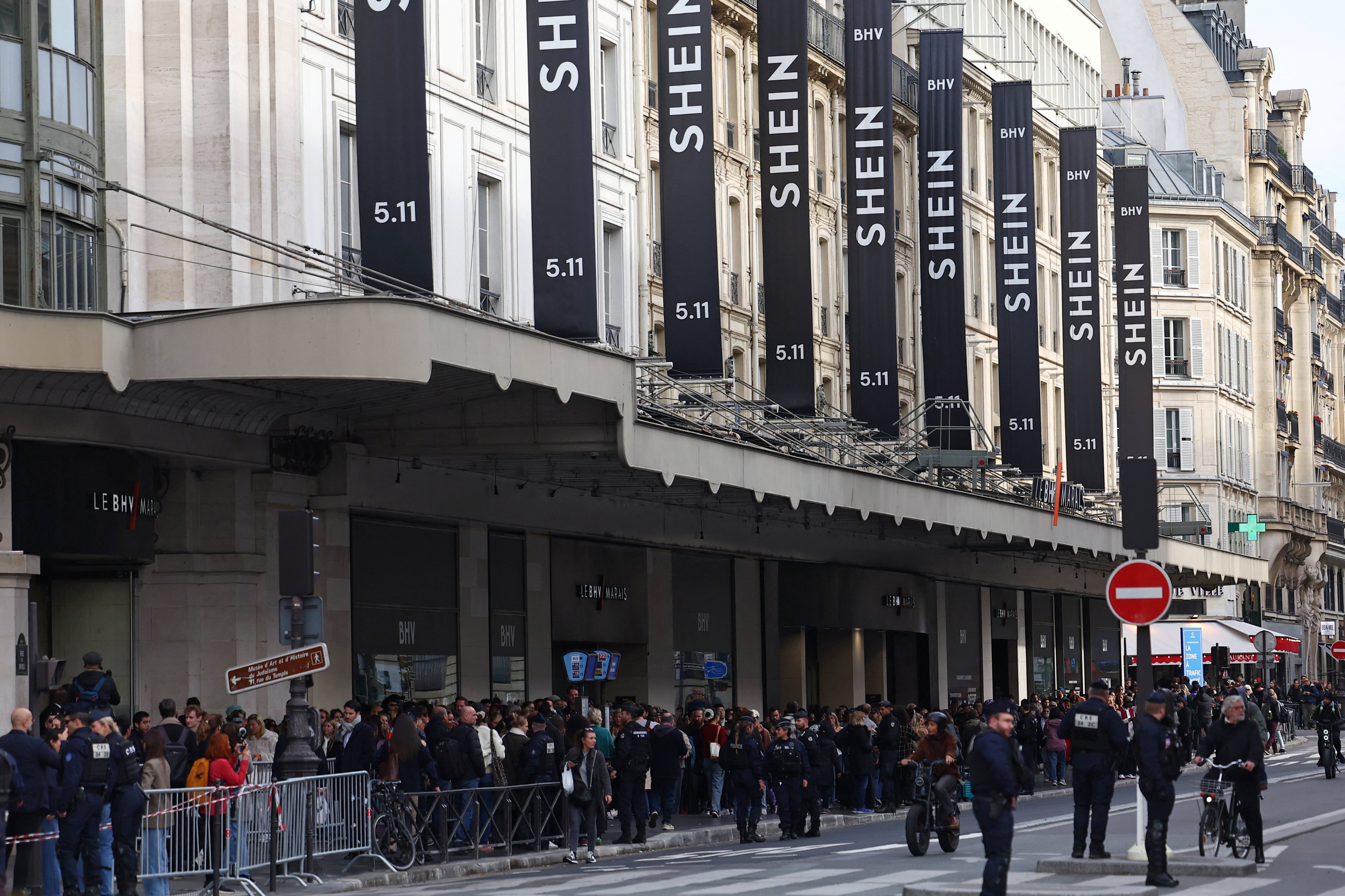 Shein signs hang above a department store in central Paris. Photo: Reuters