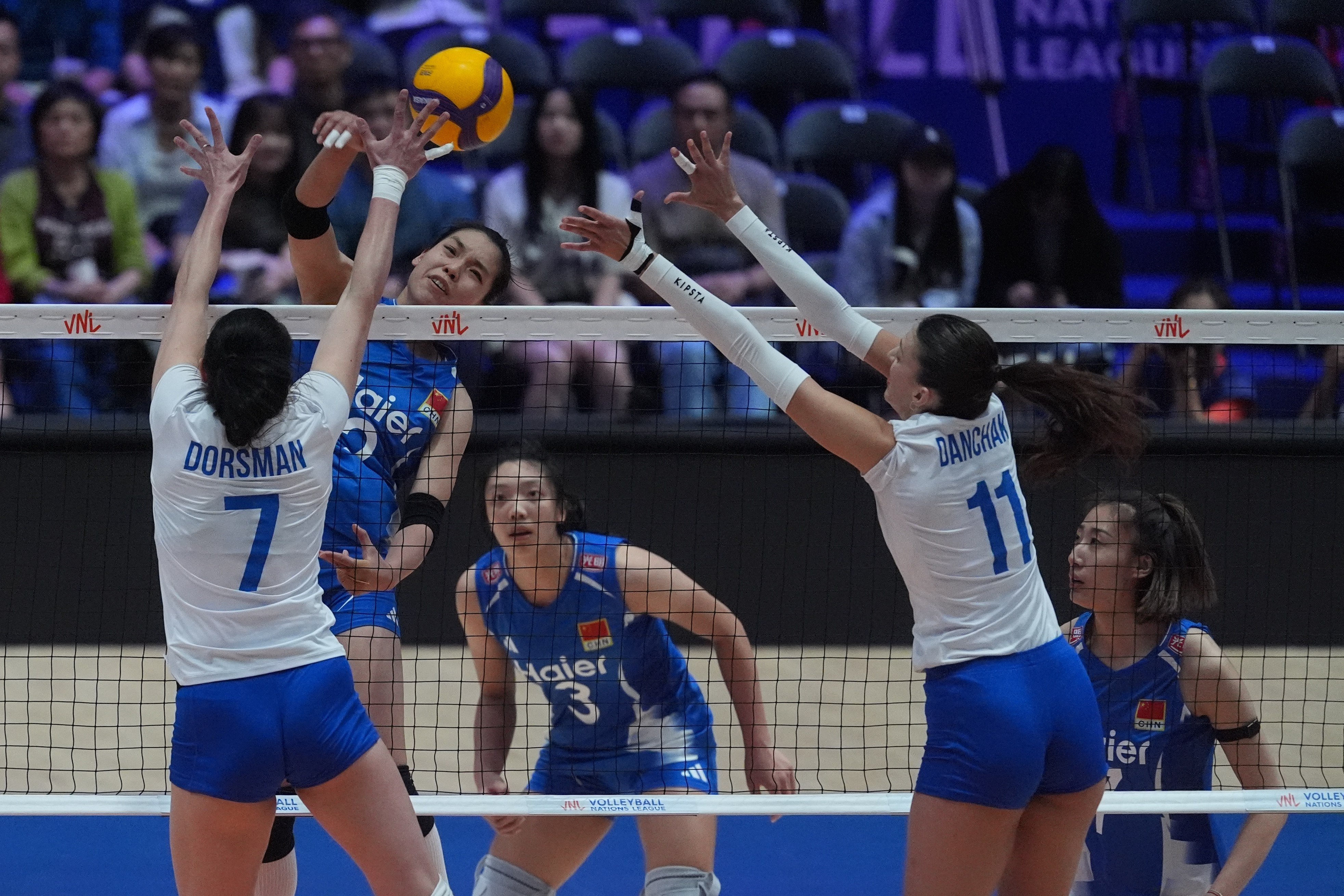China’s Zhuang Yushan tries to get through the Ukraine defence in their  Women’s Volleyball National League Hong Kong match at Kai Tak Arena on Thursday. Photo: Elson Li