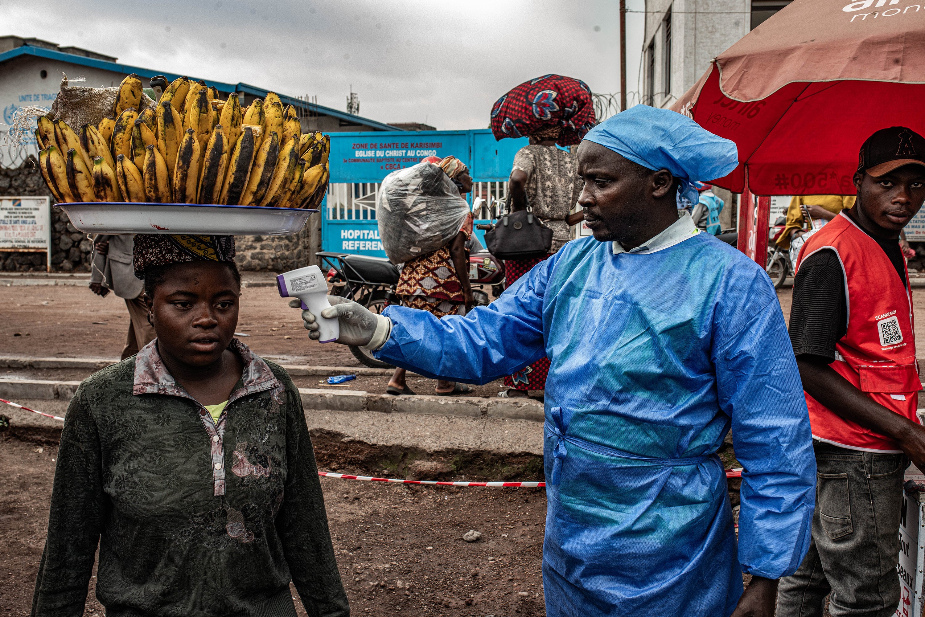 A health worker takes a woman’s temperature as part of Ebola screening efforts in Goma, Democratic Republic of Congo, in June. Photo: TNS