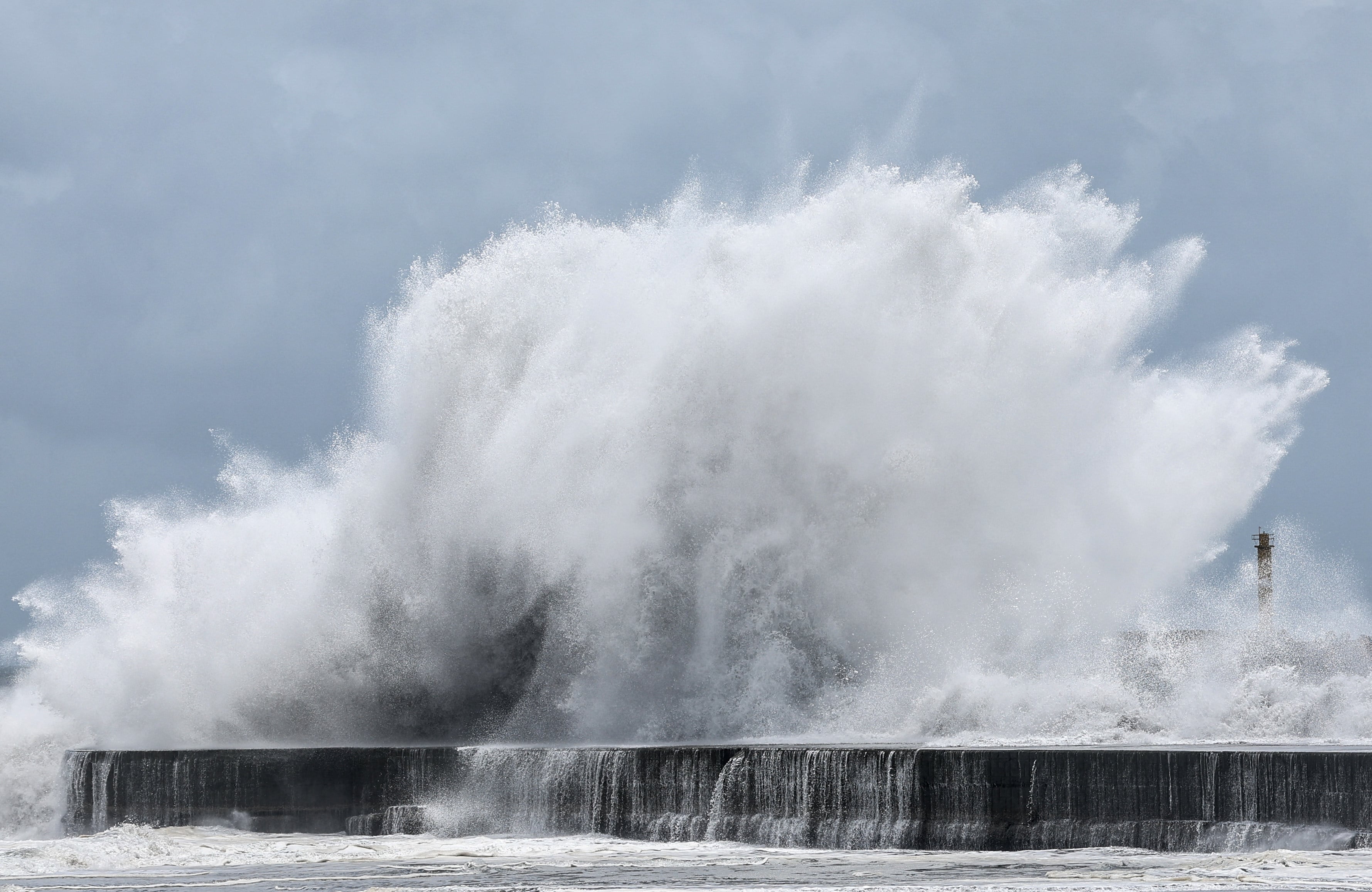 Strong waves break along the coast in Yilan on July 10, 2026, as Typhoon Bavi moves toward Northeastern Taiwan. (Photo by I-Hwa Cheng / AFP)