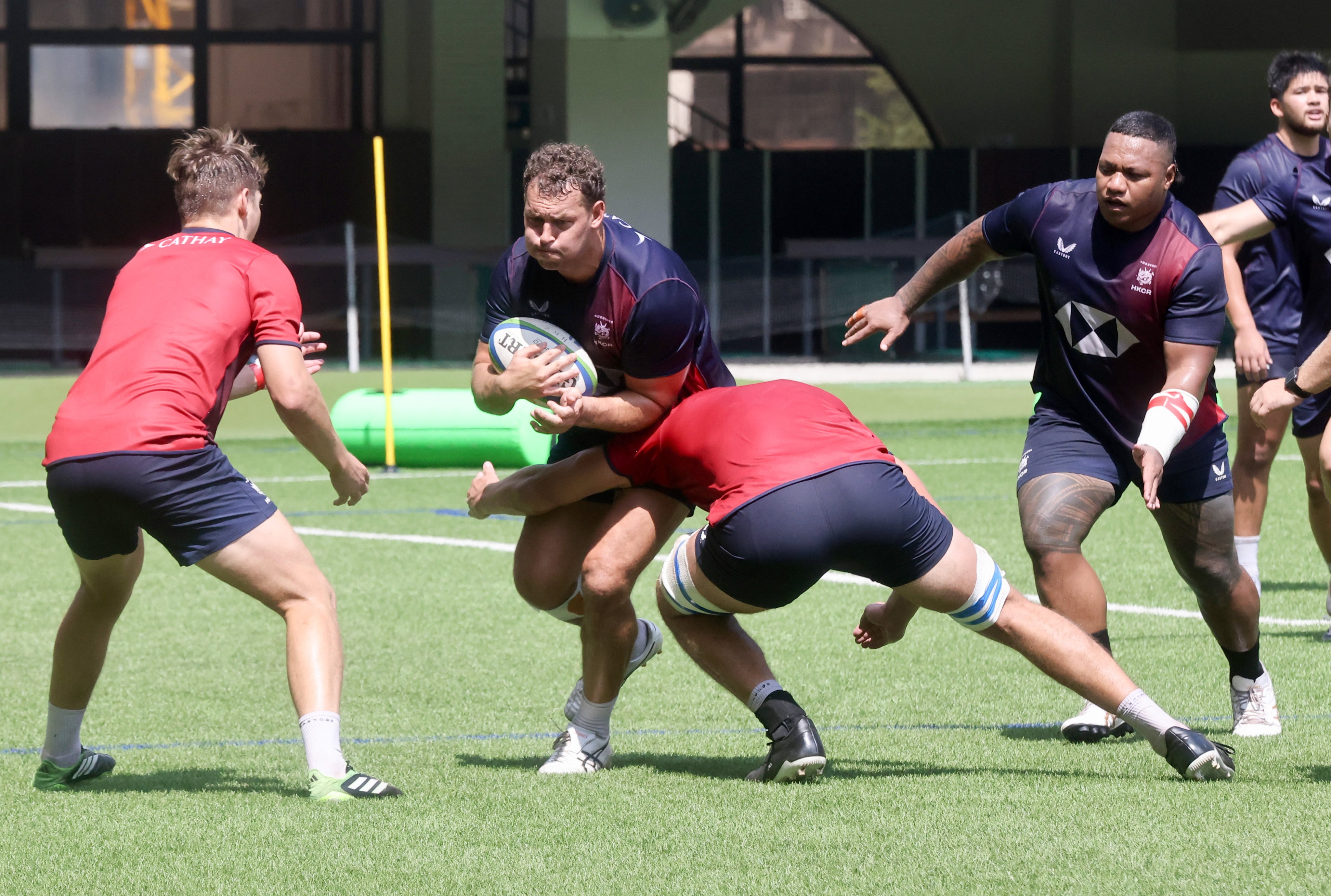 Josh Hrstich, here trying to break through a tackle in training, will return to captain Hong Kong against Chile on Sunday. Photo: Jonathan Wong
