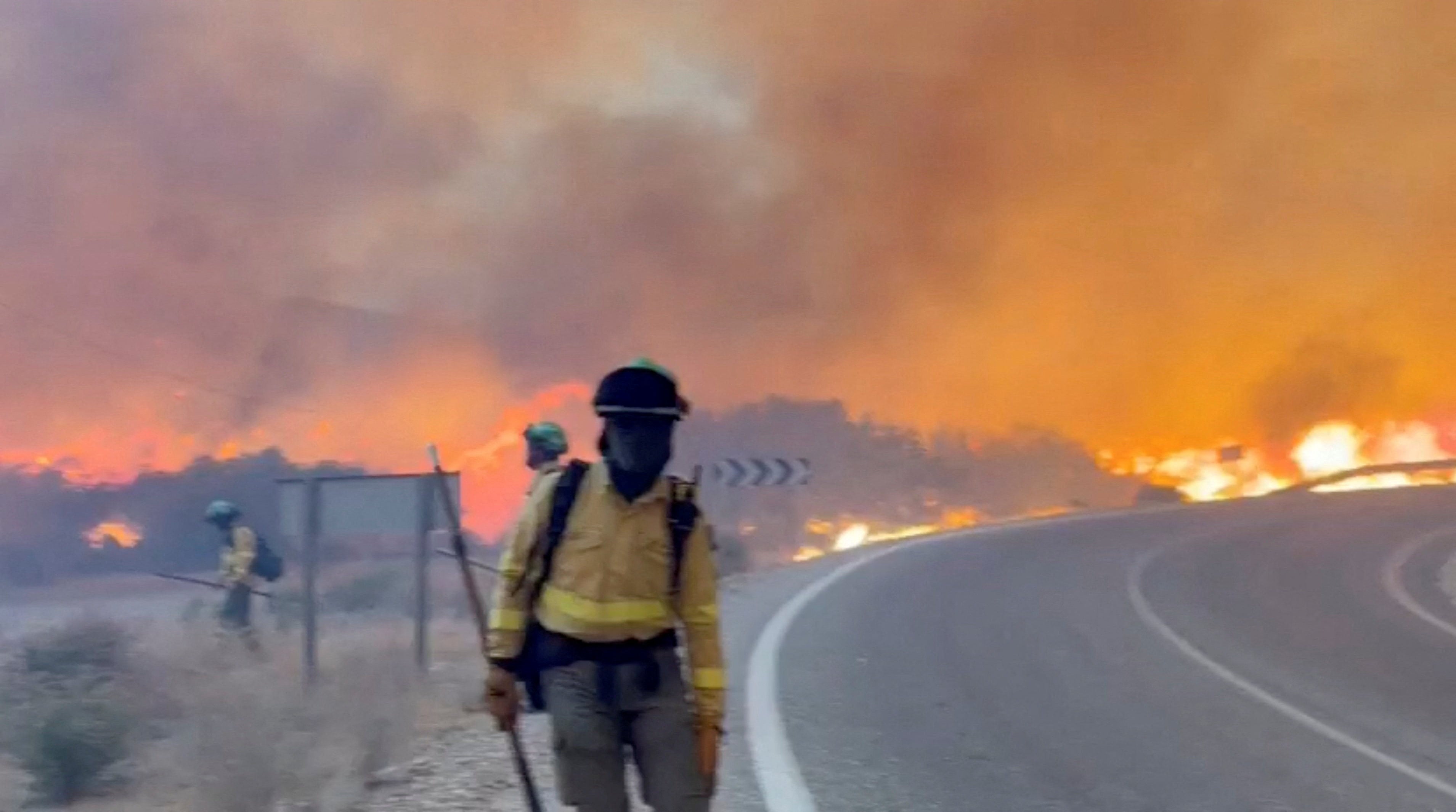 Emergency personnel work during a wildfire in Almeria, Spain, in this screengrab taken from a handout video released on Friday. Photo: Handout via Reuters