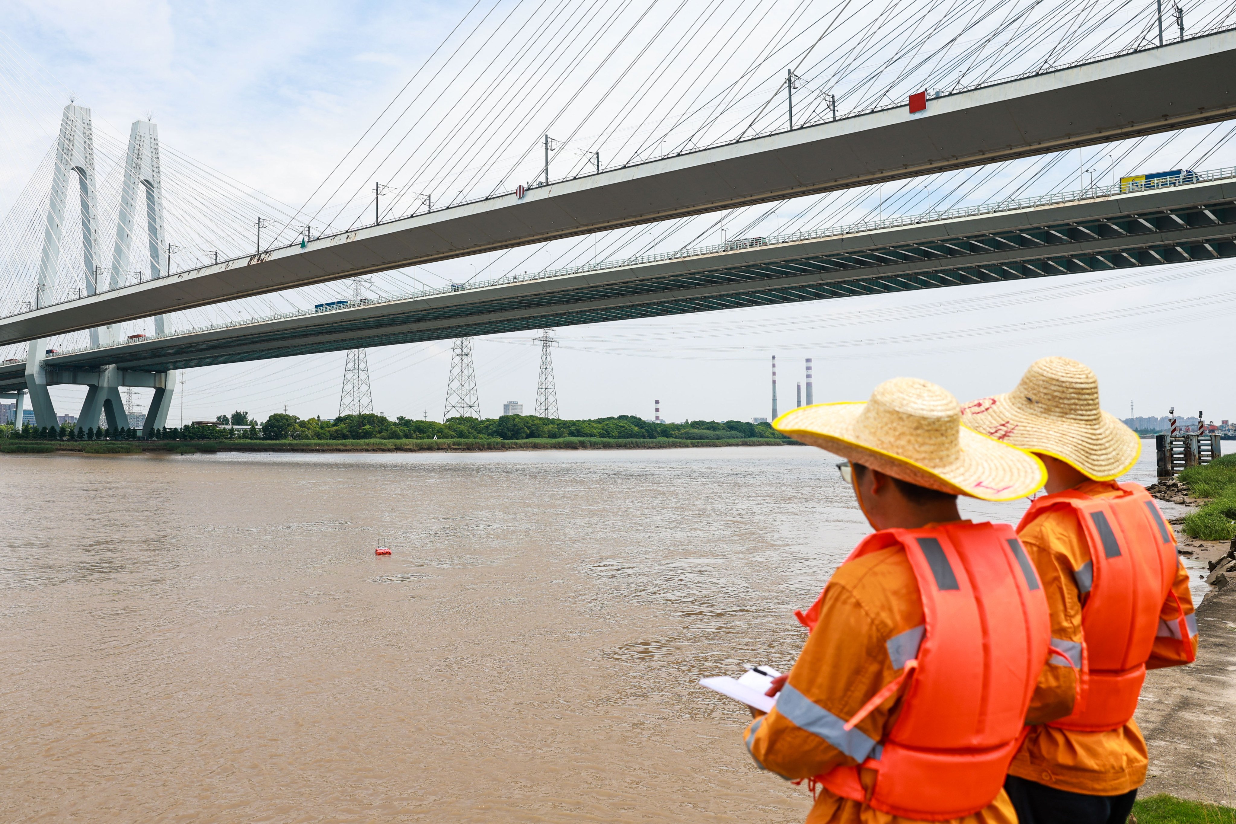 Railway workers inspect a bridge in Ningbo City, eastern China’s Zhejiang province, ahead of Typhoon Bavi making landfall on the Chinese mainland. Photo: Xinhua