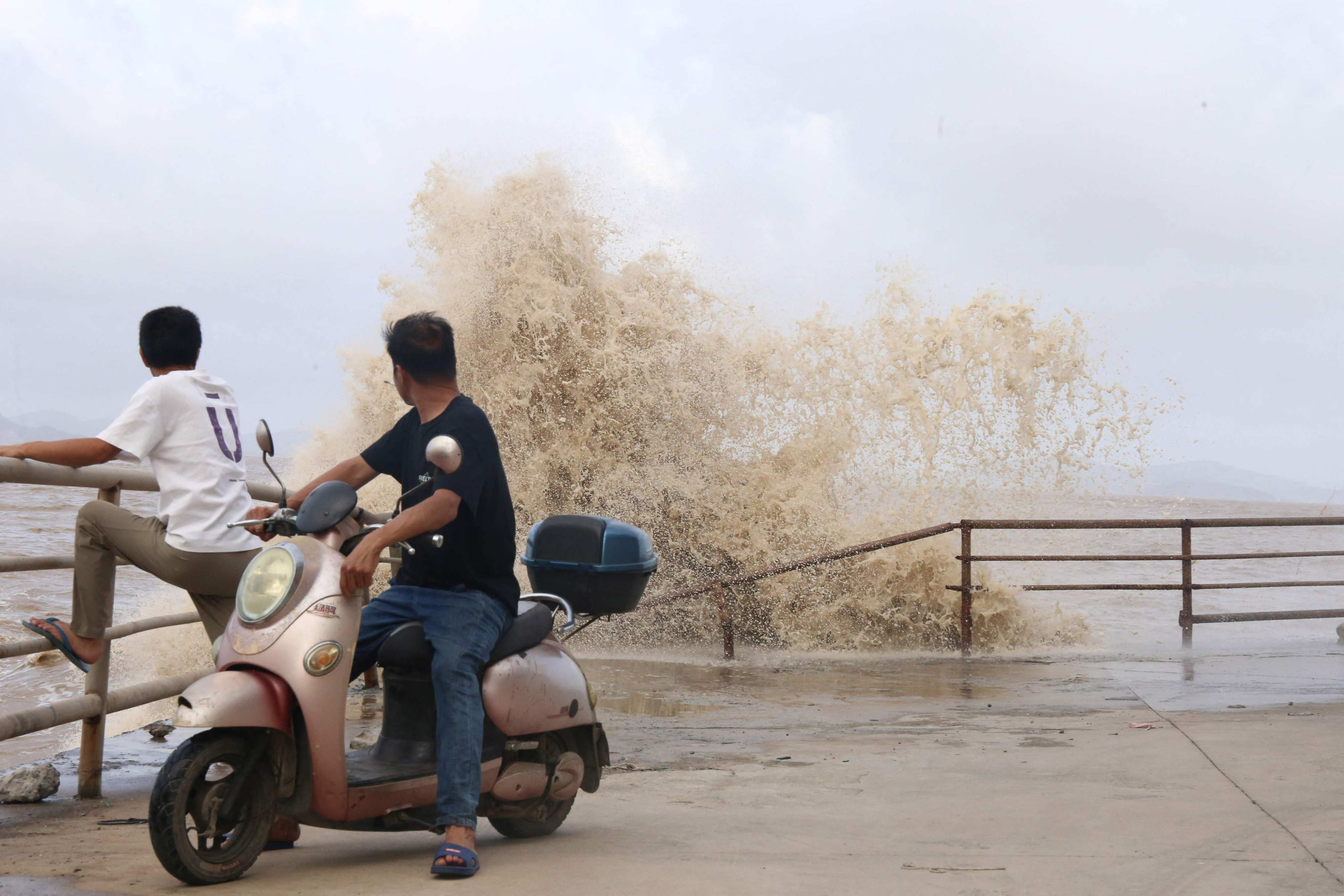 Large waves crash against the coast in Wenling city, Zhejiang province ,as Typhoon Bavi approaches the east coast of China. Photo: AFP