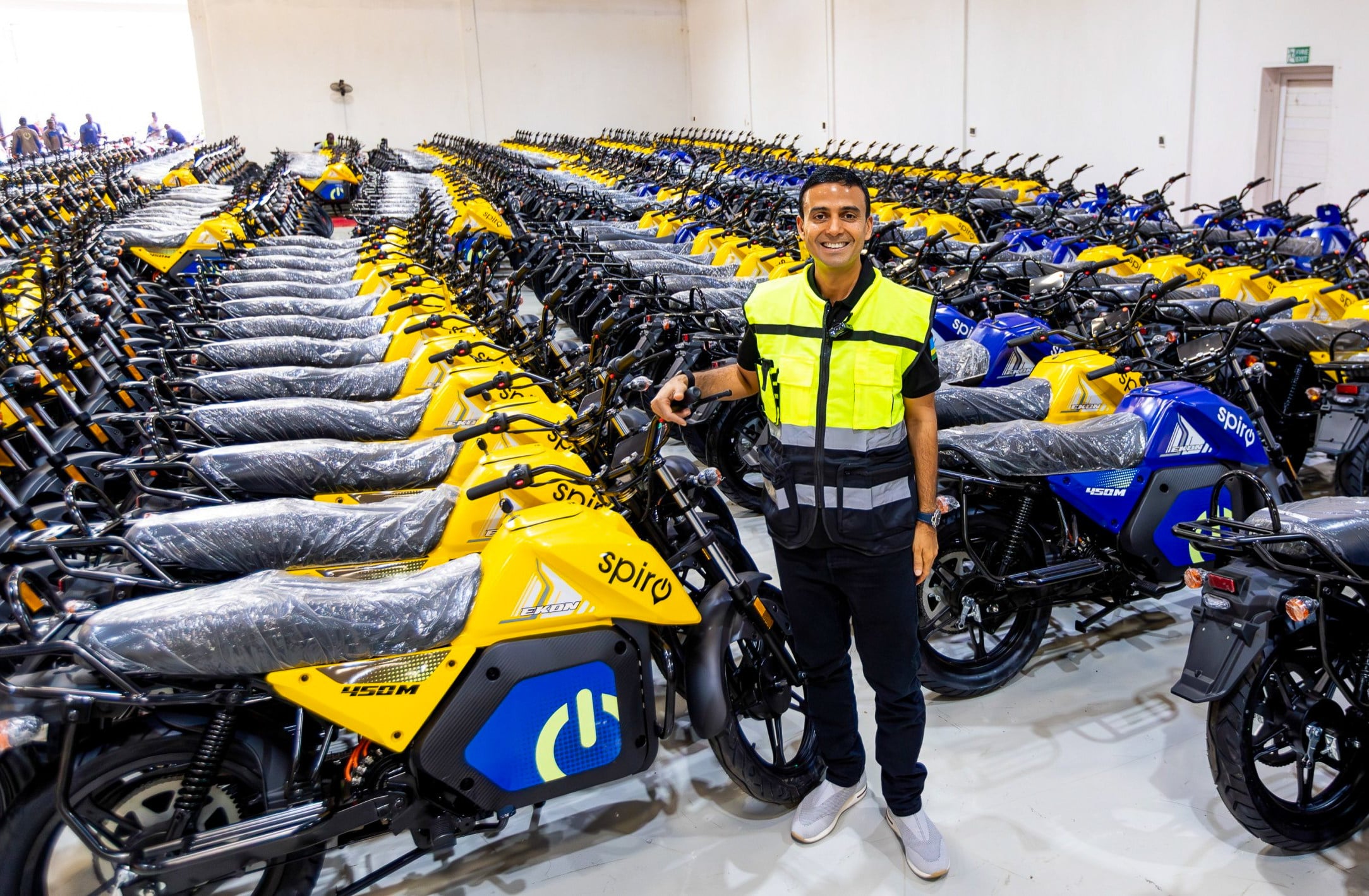 Gagan Gupta, the founder of Spiro, Africa’s largest electric two-wheeler provider, stands in a packed warehouse. Photo: Handout