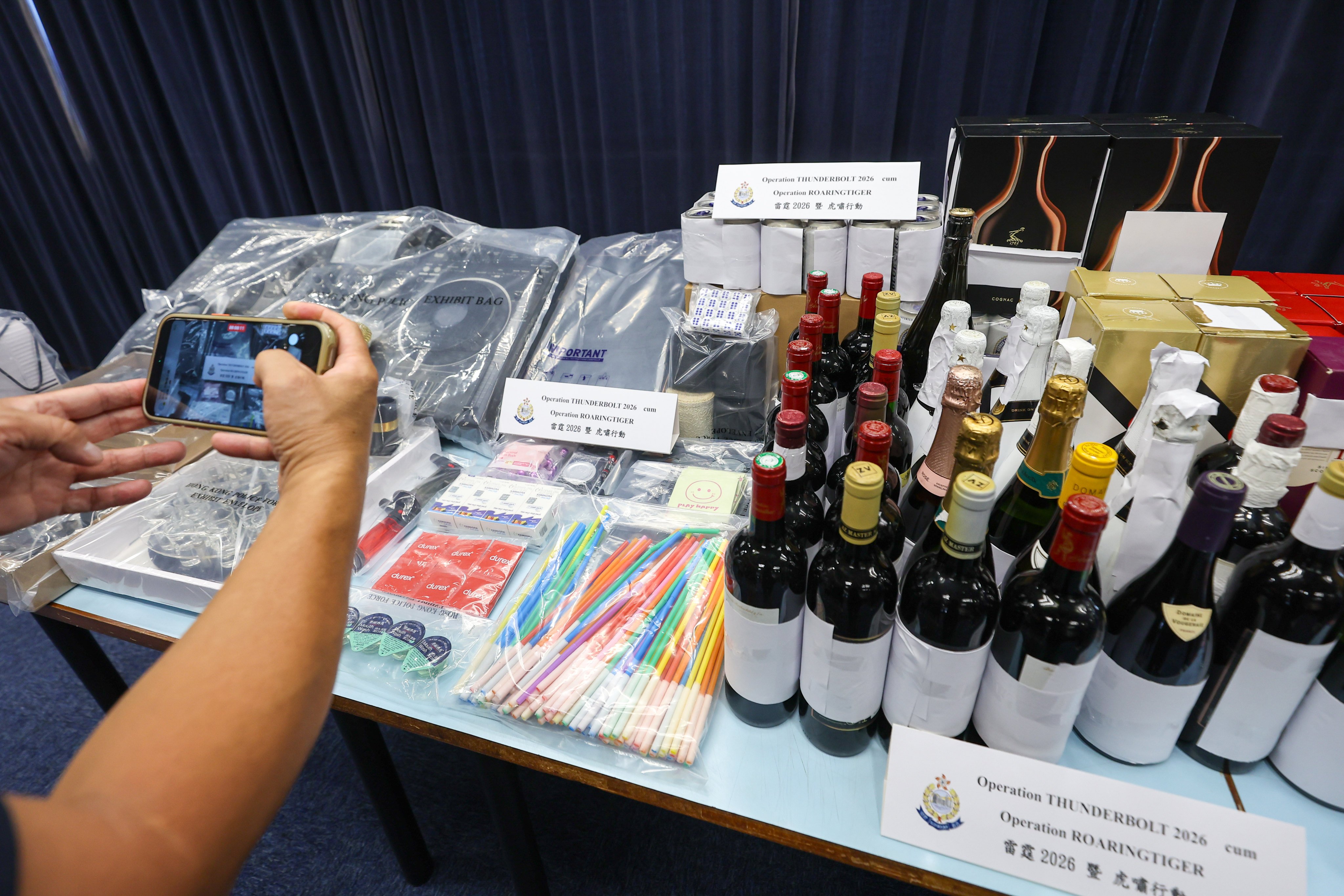 Condoms, mouthwash, lubricant, large quantities of alcohol and illicit drugs with an estimated street value of HK$190,000 was seized during the raids in Hung Hom. Photo: Edmond So