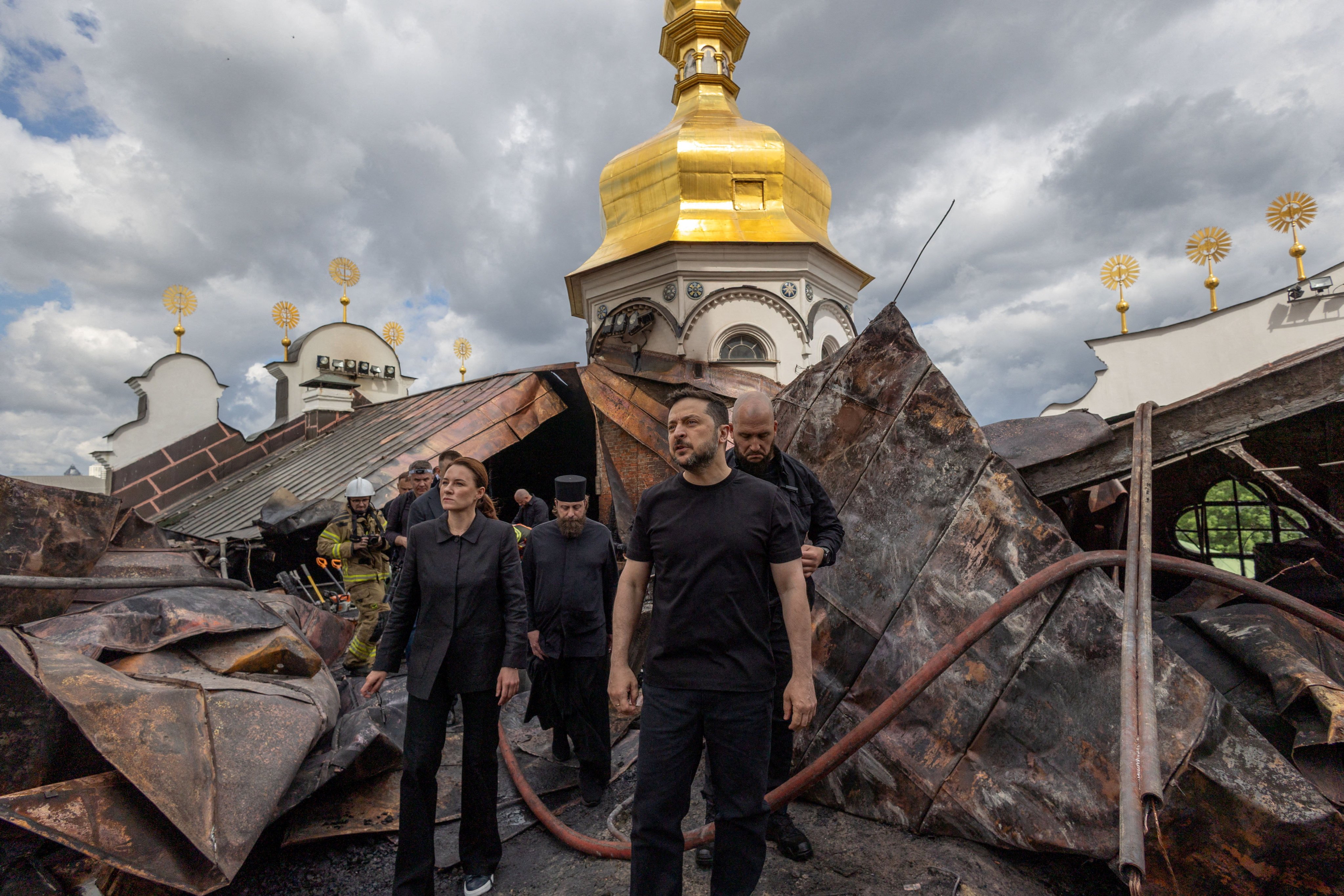 Ukrainian President Volodymyr Zelensky and Prime Minister Yulia Svyrydenko visit the Dormition Cathedral of the Kyiv Pechersk Lavra, which was hit during Russian strike in June. Photo: Ukrainian Presidential Press Service via Reuters