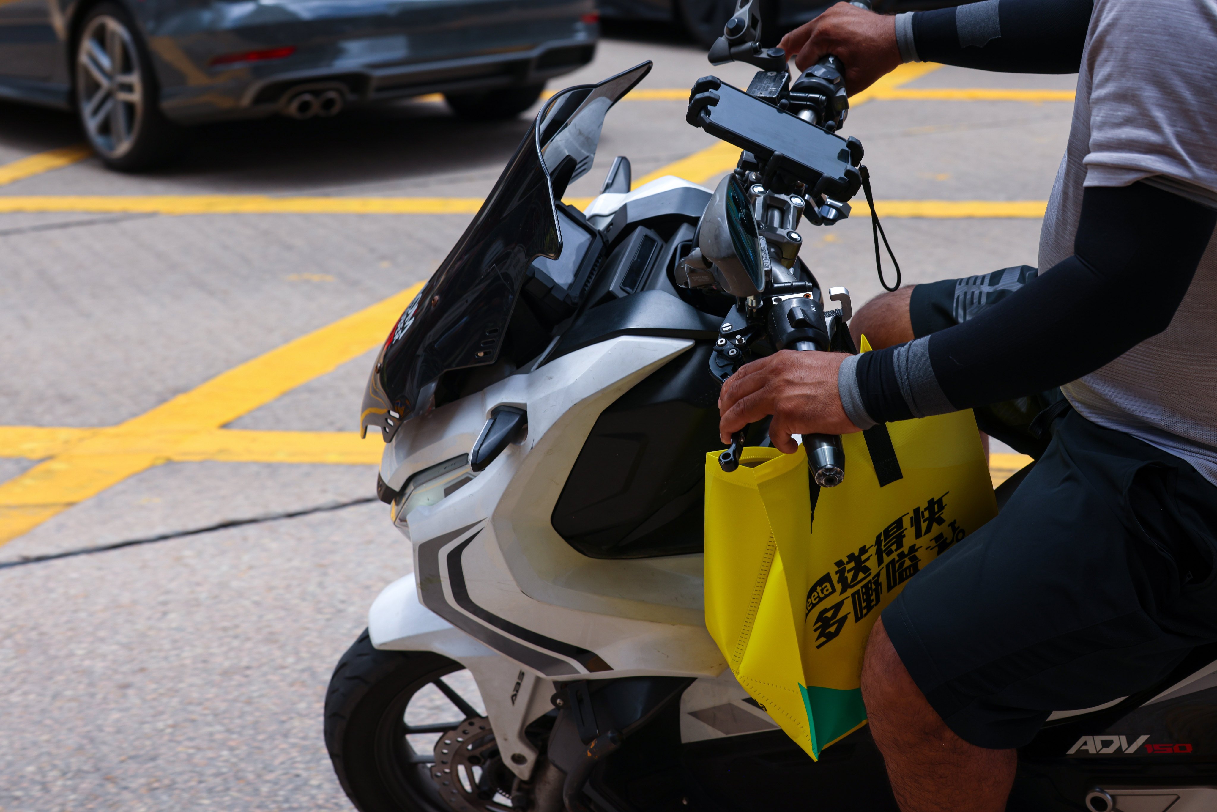 A motorcycle delivery worker is seen on Nathan Road in Jordan on June 12, 2025. Photo: Jelly Tse