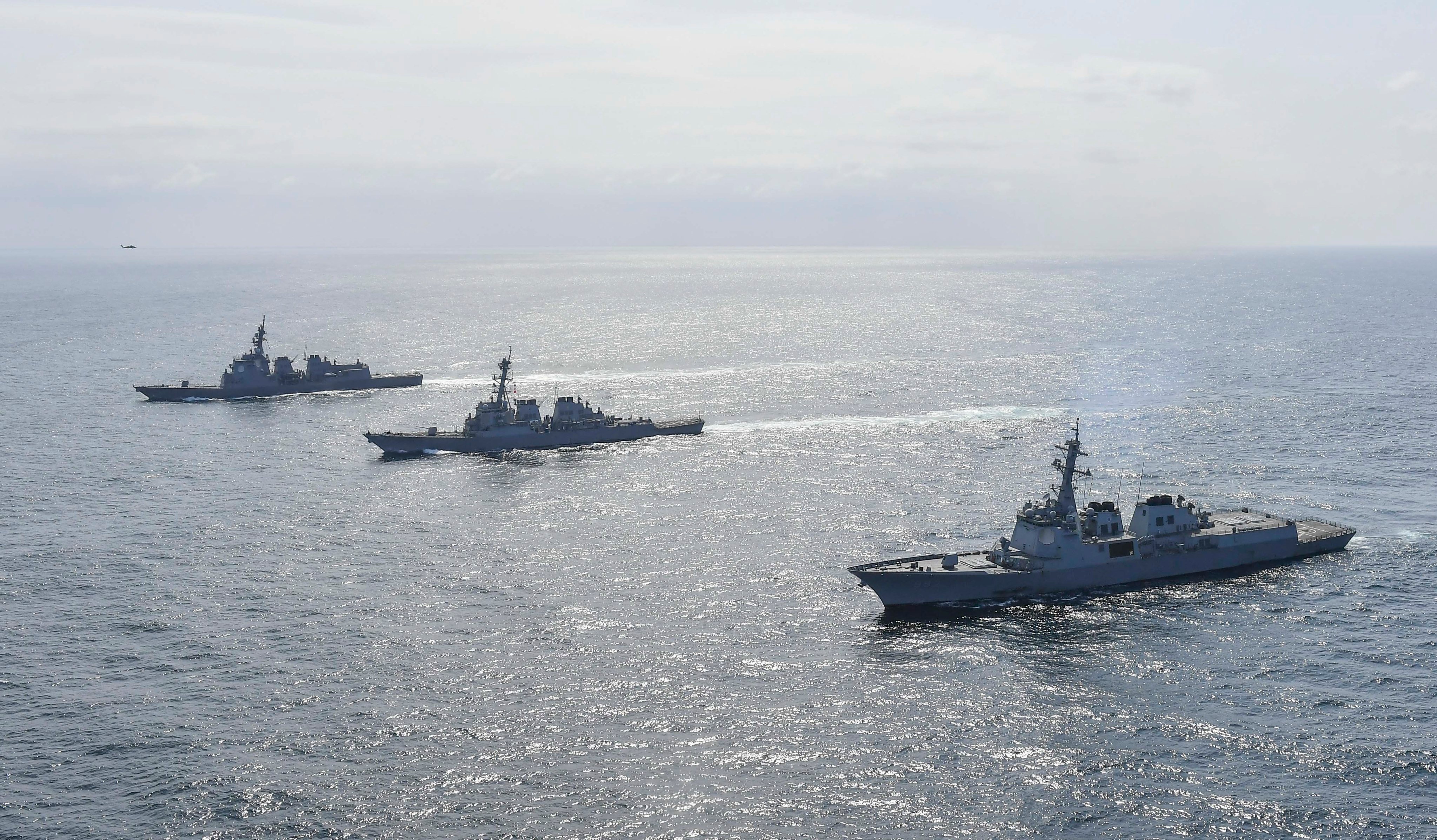 South Korean and Japanese navy ships sail in waters off South Korea’s east coast during a joint exercise in April 2023. Photo: EPA-EFE