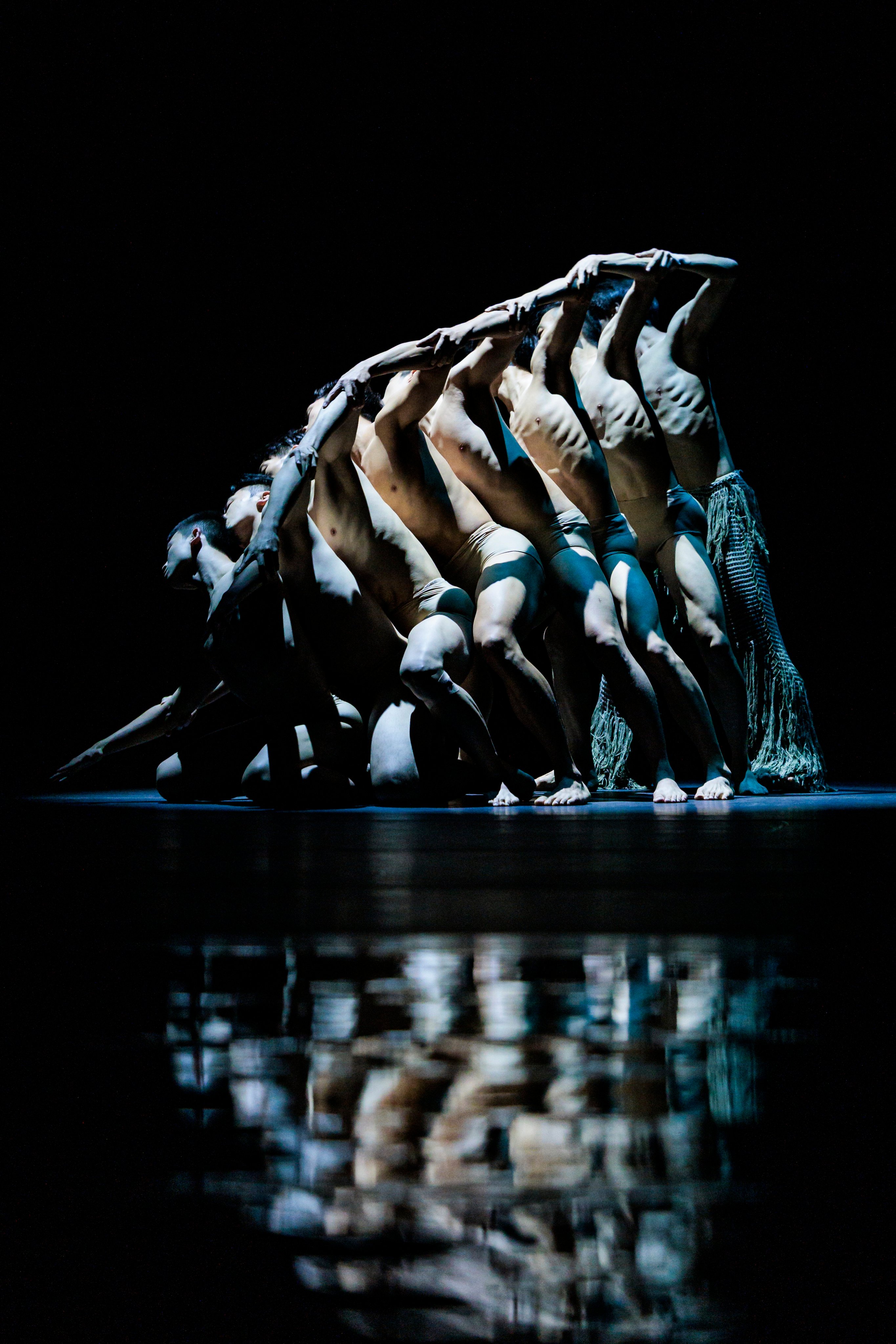 Teh beginning of “Lunar Halo” sees a single male body dissolving into a swaying line of men. This performance by Taiwan’s Cloud Gate Dance Theatre took place at the Xiqu Centre in Hong Kong on July 10, 2026 (Photo: Eric Hong @ Moon 9 Image Courtesy of West Kowloon Cultural District Authority)