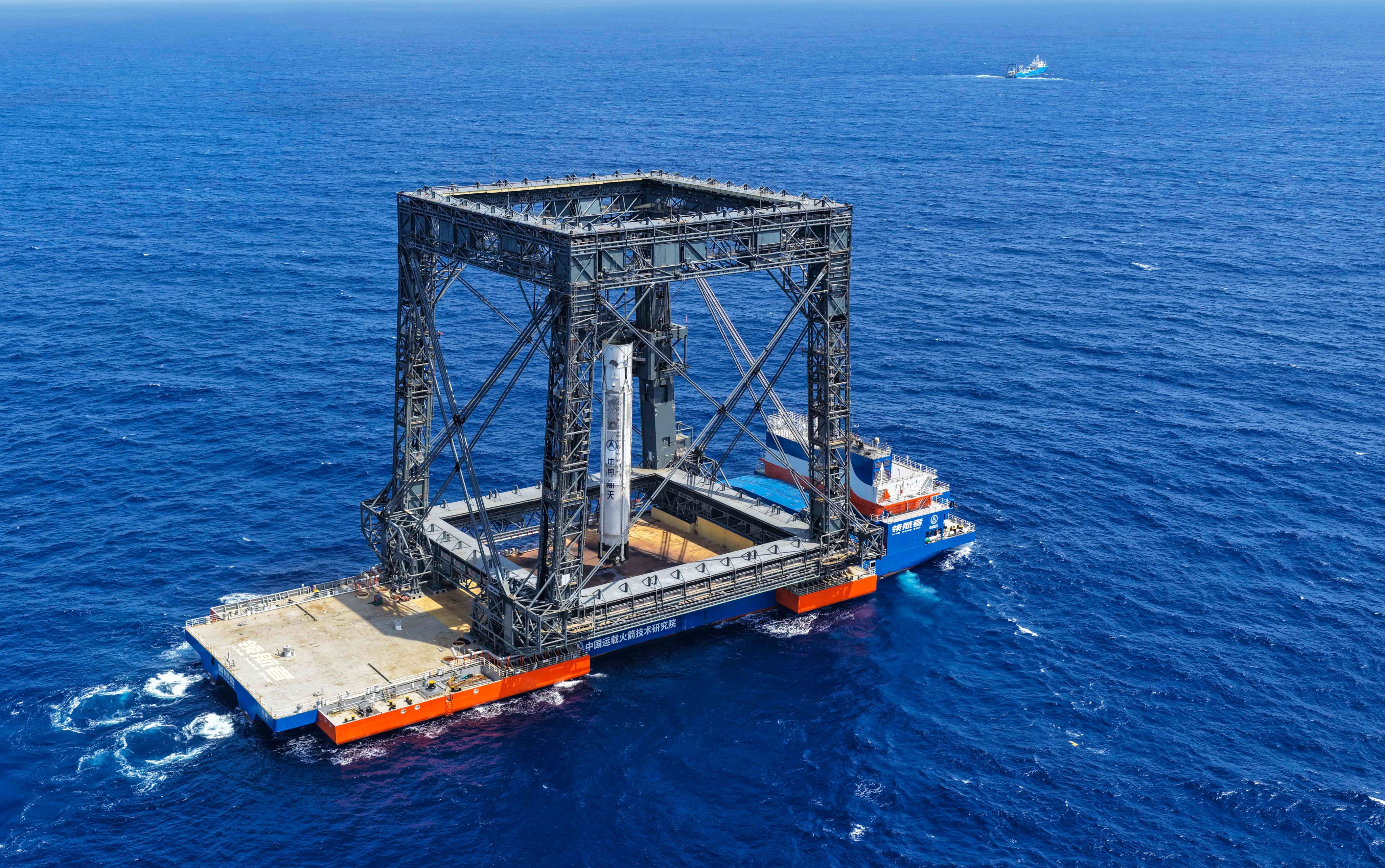 This drone photo taken last Friday shows the successful capture of the returned first stage of a Long March-10B carrier rocket on a seaborne platform. Photo: Xinhua