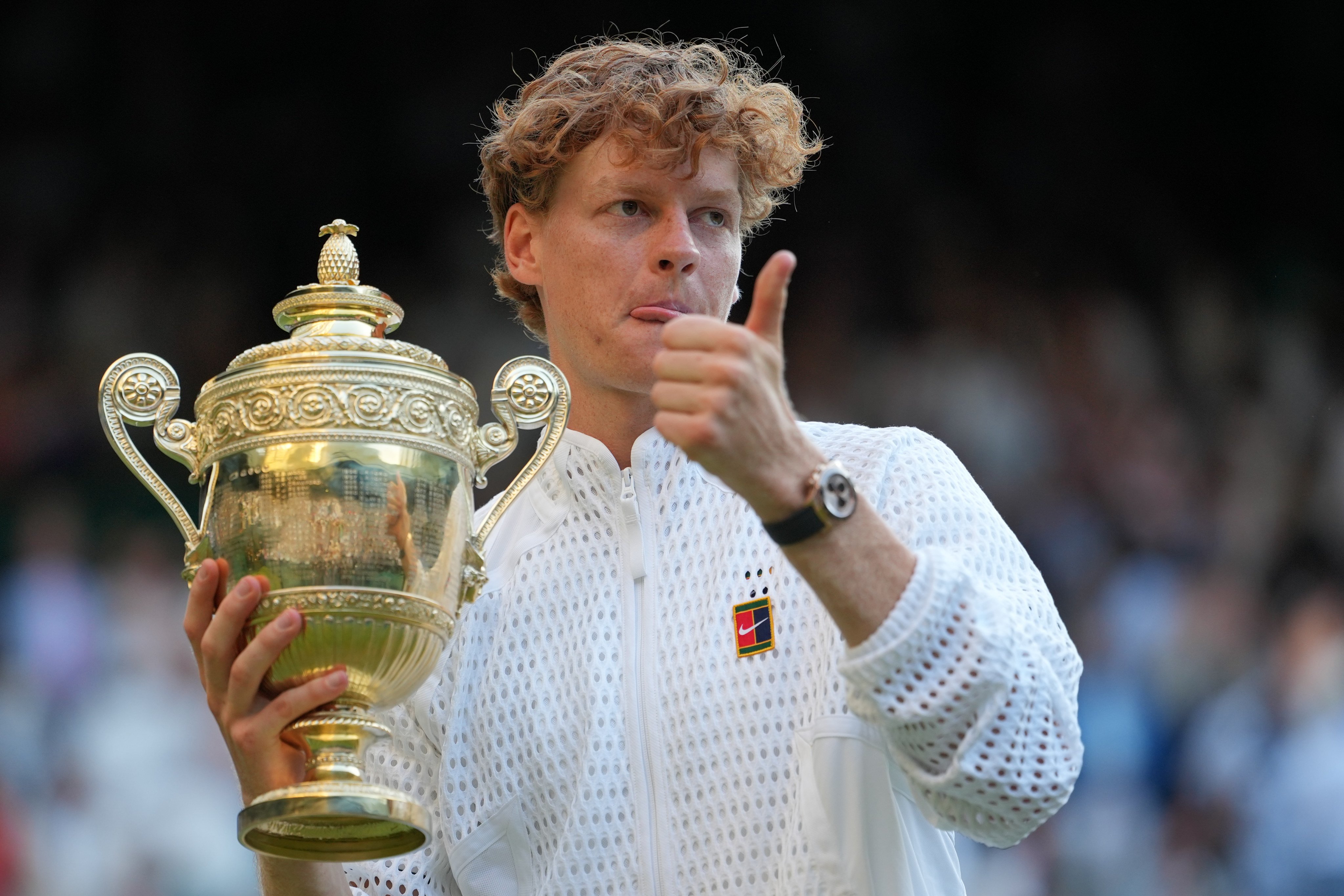 Italy’s Jannik Sinner holds the trophy after defeating Alexander Zverev of Germany in the men’s singles final at the Wimbledon Tennis Championships in London on Sunday. Photo: AP
