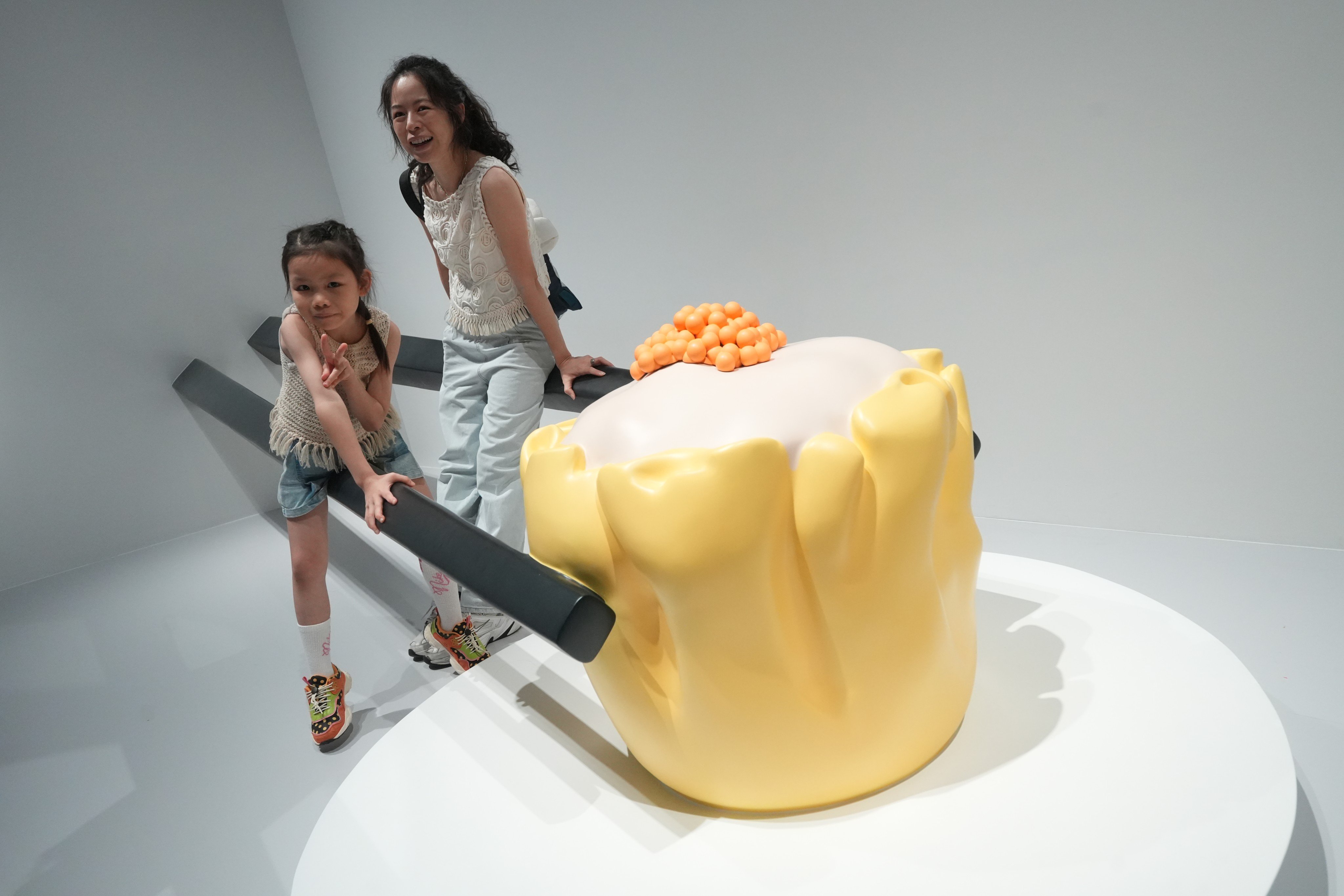 Visitors at the “Do it!” station at “Design Ah! Experience
the Wonder of Everyday Design” at M+. Photo: Sun Yeung